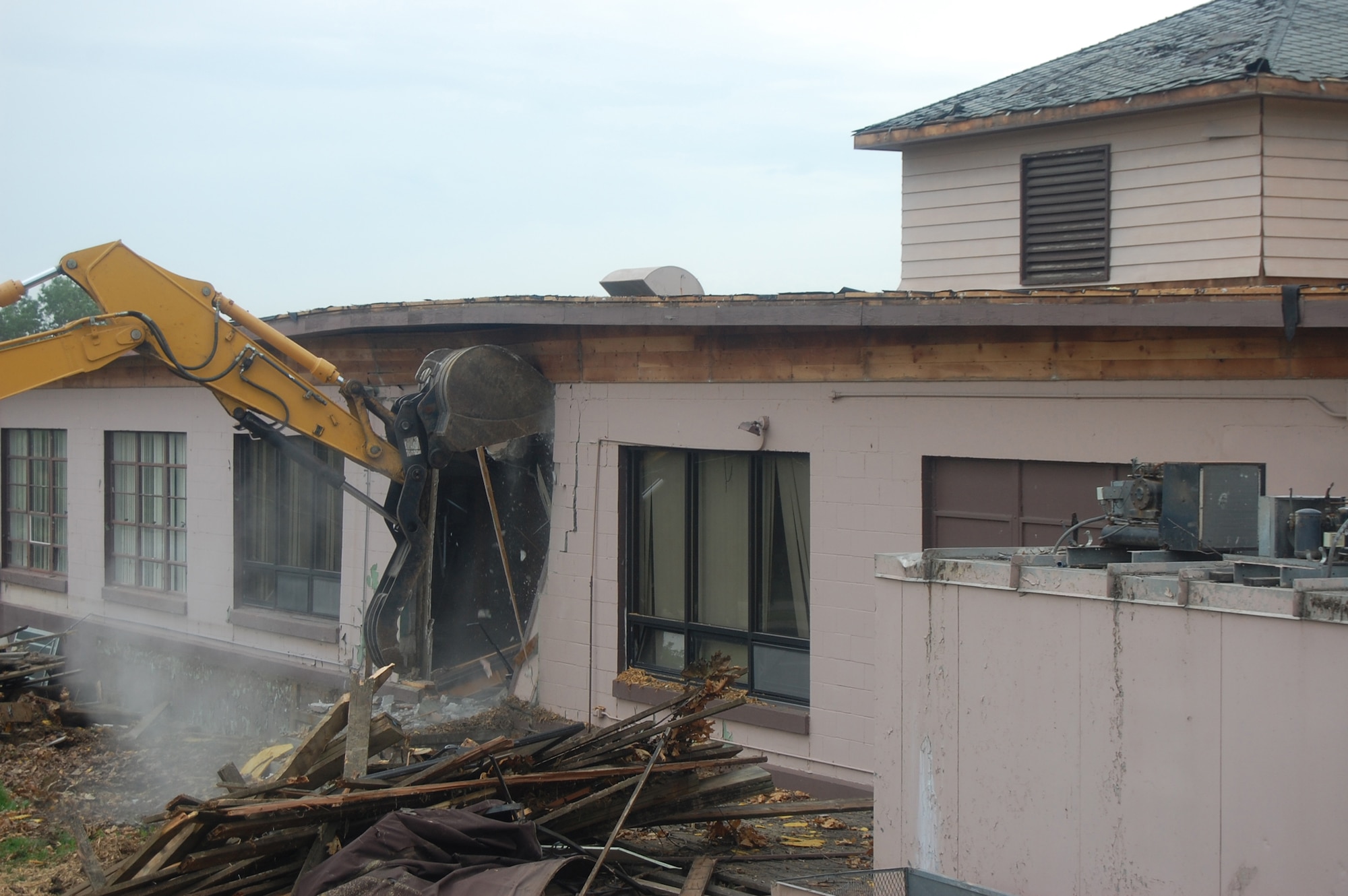 OFFUTT AIR FORCE BASE, Neb. -- Building 418 is demolished here July 27. The facility served numerous purposes including as an Airman's club, community center and military clothing sales store. U.S. Air Force Photo by Staff Sgt. James M. Hodgman