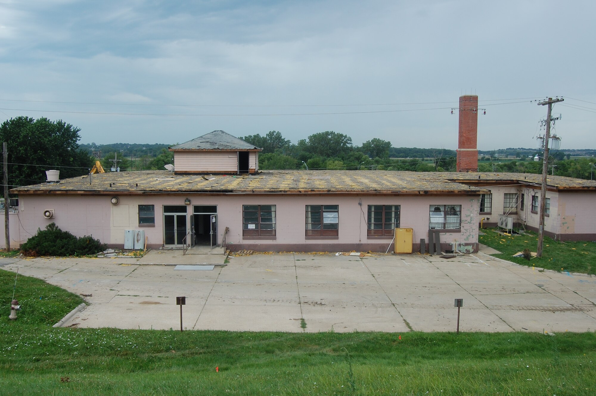 OFFUTT AIR FORCE BASE, Neb. -- Building 418 waits to be demolished here July 27. The facility served numerous purposes including an Airman's club, community center and military clothing sales store. U.S. Air Force Photo by Staff Sgt. James M. Hodgman