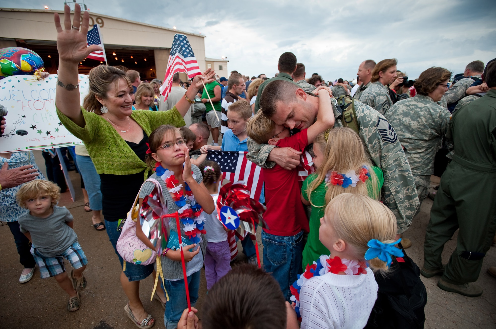 Air Force Master Sgt. Ray Carter, aerospace ground equipment technician, 140th Wing, Buckley Air Force Base, Colorado Air National Guard, receives a joyous and tearful welcome home following his return from Joint Base Balad, Iraq. Master Sgt. Carter was deployed in support of Operation Iraqi Freedom. (U.S. Air Force photo/Master Sgt. John Nimmo, Sr.) (RELEASED)