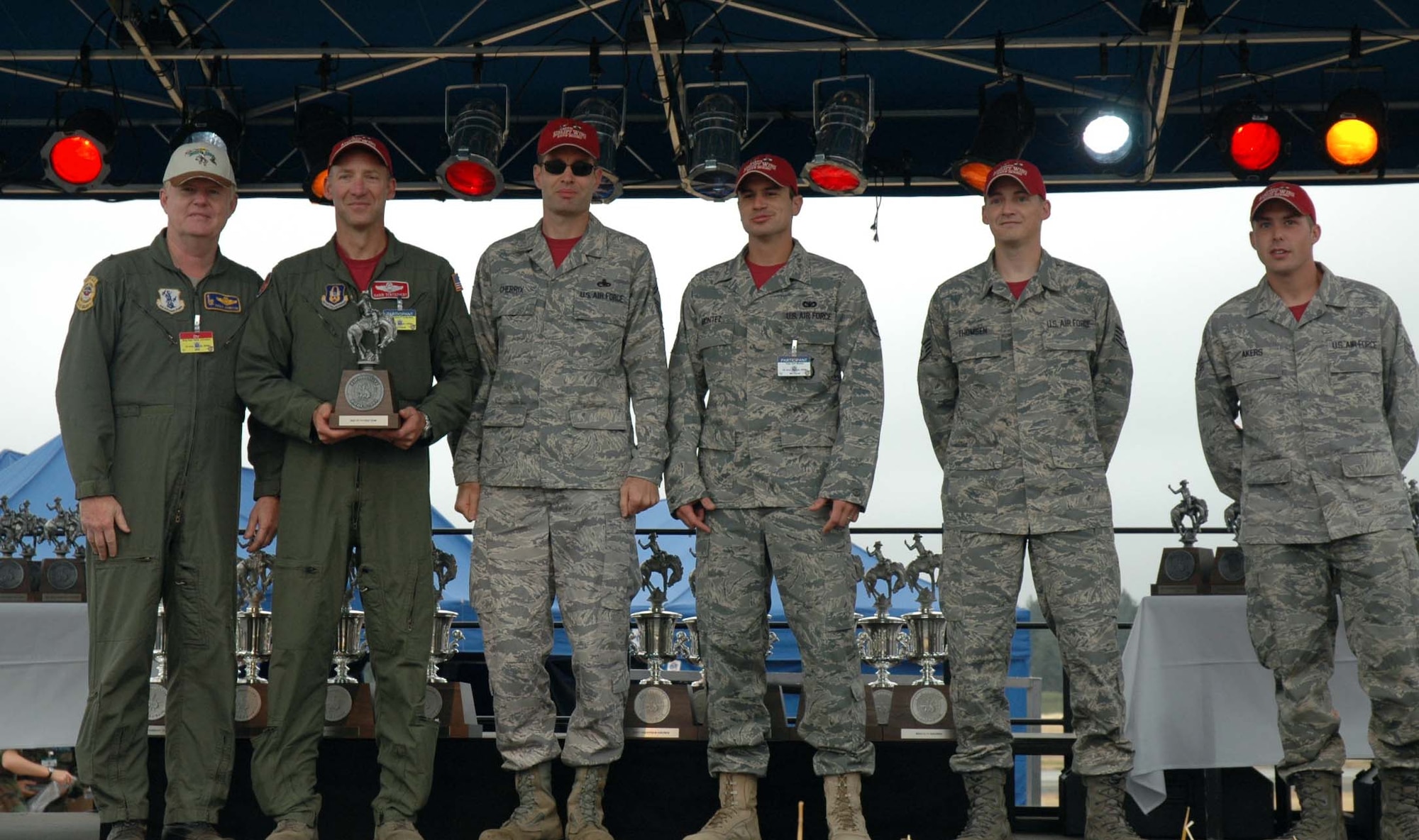 Reserve members from the 446th Airlift Wing Rodeo team, McChord Air Force Base, Wash., are presented the Best Fit to Figtht Trophy at Air Mobility Command's Rodeo 2009 here. From left to right, Brig. Gen. XXXX, XXXX commander, Lt. Col. Garin Tentschert, 446th AW team chief, Senior Master Sgt. Mark Cherrix, 446th Maintenance team chief, Staff Sgt. Jack Montez, 446th Security Forces, and Staff Sgt. Ben Thomsen and Senior Tyler Akers, both with 446th Aerial Port. (U.S. Air Force photo/Airman 1st Class Patrick Cabellon)