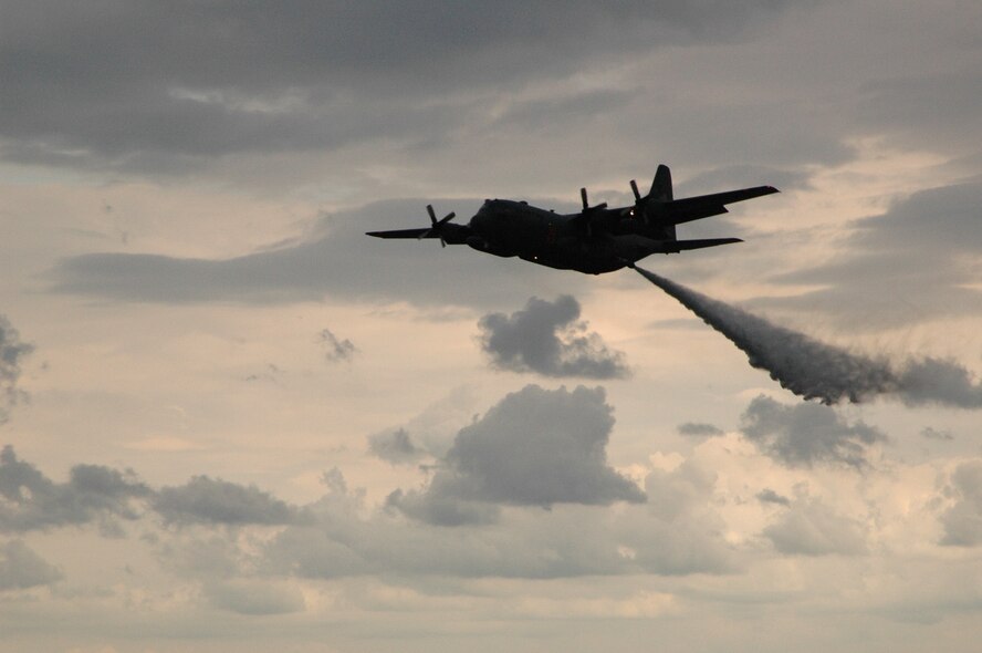 An Air Force Reserve C-130 equipped with the Modular Airborne Firefighting System, or 'MAFFS II, presents a live water drop July 27 at the Experimental Aircraft Association AirVenture airshow in Oshkosh, Wis. The airshow is known as the world's greatest aviation celebration and attracts hundreds of thousands of aviation enthusiasts from all over the world. The C-130, assigned to the 302nd Airlift Wing at Peterson Air Force Base, Colo., is equipped with the new MAFFS II system and is on display at EAA AirVenture through July 29. (U.S. Air Force Photo/Capt. Jeff Schoen)