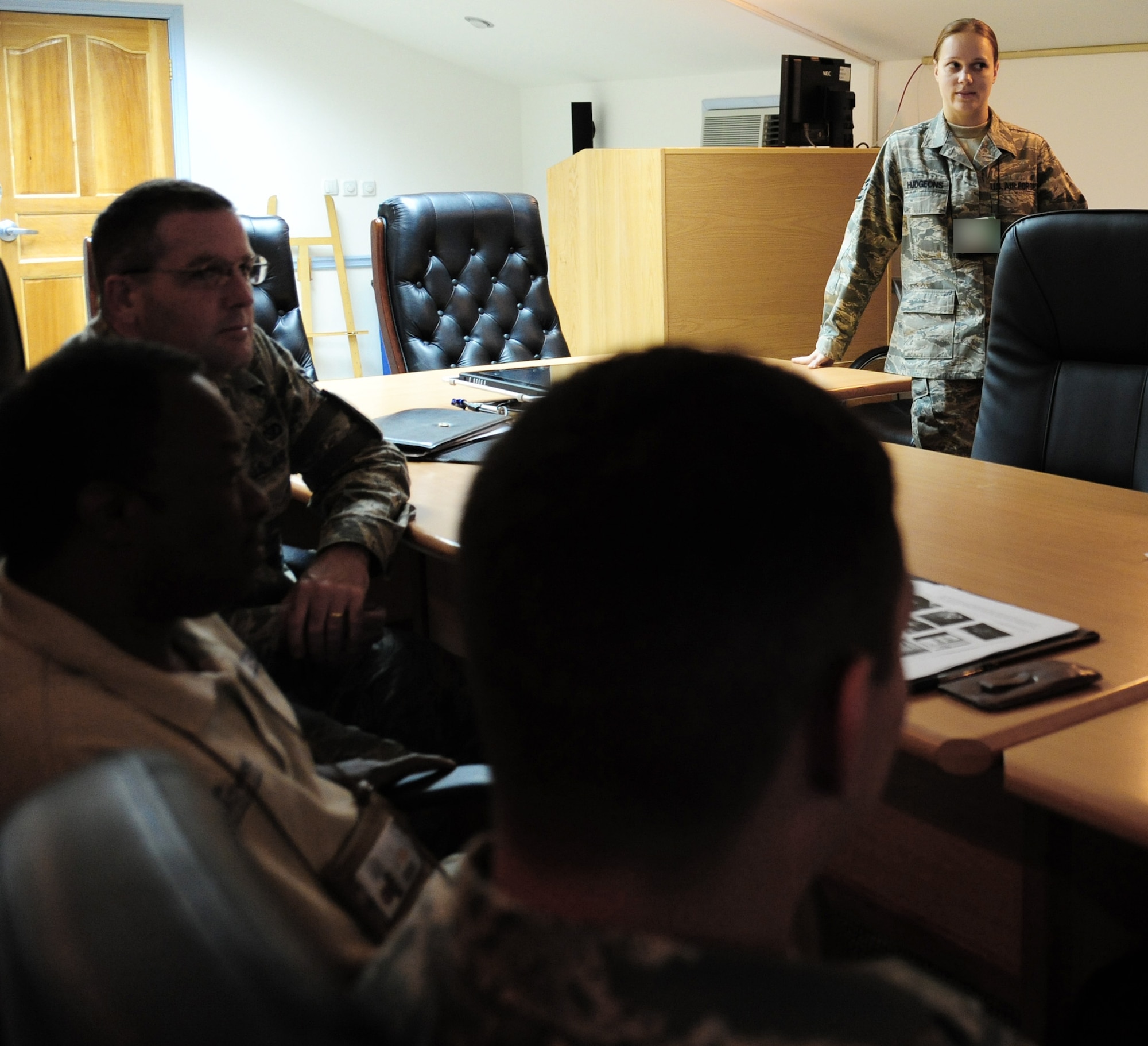Staff Sgt. Maria Hudgeons teaches a Russian language class at the 376th Air Expeditionary Wing conference room July 15 at the Transit Center at Manas Air Base, Kyrgyzstan. Sergeant Hudgeons is a coalition coordinator and linguist assigned to the 376th Air Expeditionary Wing. She is deployed from the 2nd Comptroller Squadron at Barksdale AFB, La. (U.S. Air Force photo illustration)