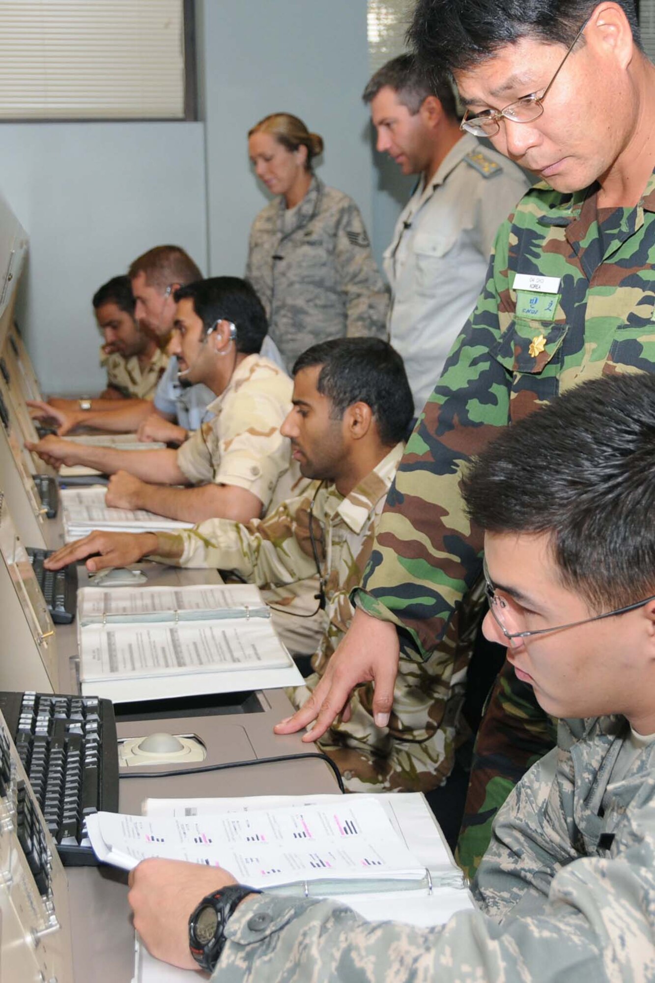 Airmen train side by side with students from several nations in the 334th Training Squadron’s airfield operations officer course in Cody Hall.  (U.S. Air Force photo by Kemberly Groue)