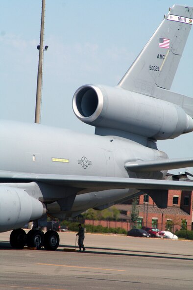 Airmen prepare a KC-10 Extender from the 60th Air Mobility Wing, Travis Air Force Base, Calif., for a flight at McChord AFB, Wash., July 25, 2009.  The KC-10 is one of the Air Mobility Command's main air refuleing planes that helps provide "global reach" and the Air Force to "fly, fight and win...in air, space and cyberspace."  (U.S. Air Force Photo/Tech. Sgt. Scott T. Sturkol)