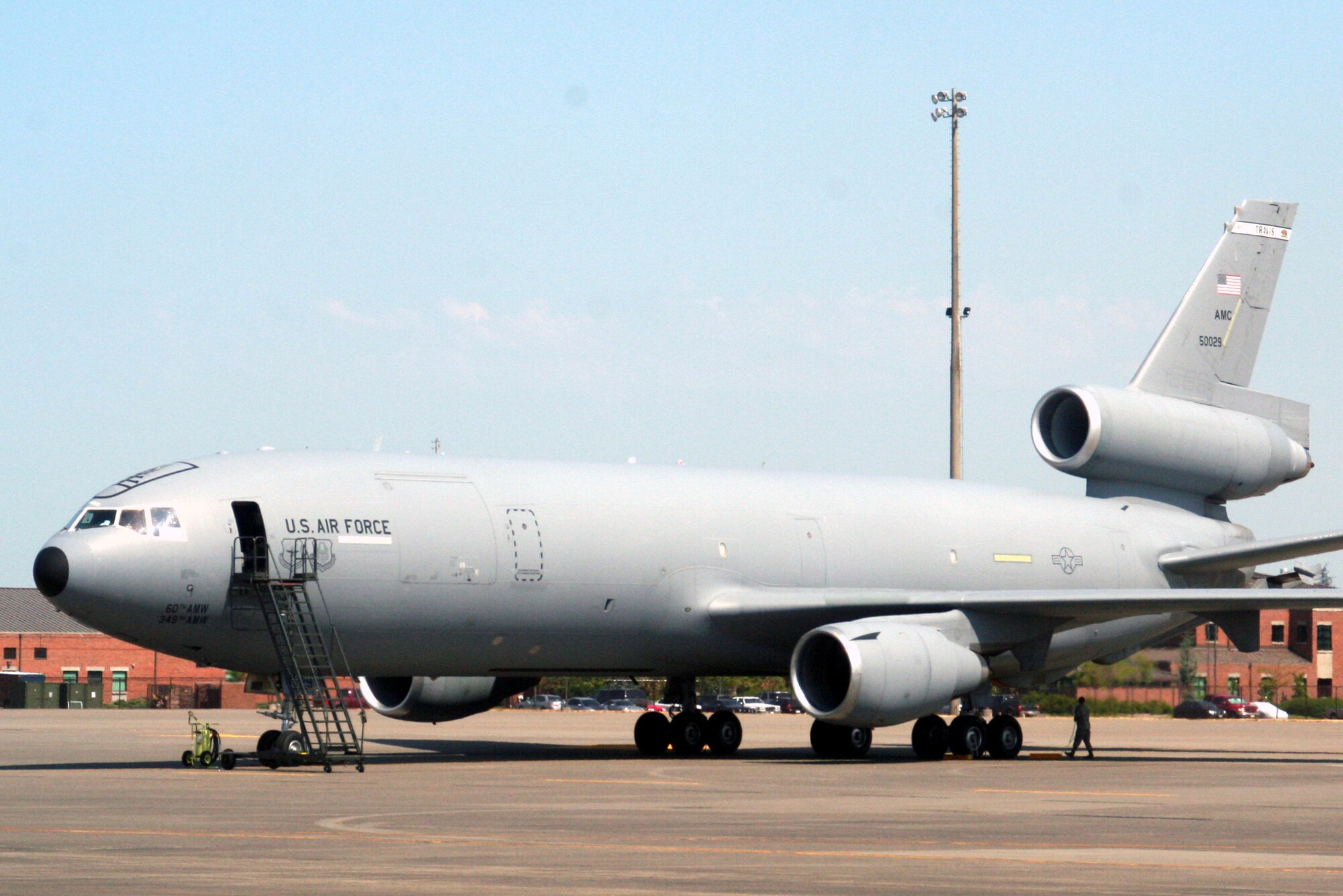 Airmen prepare a KC-10 Extender from the 60th Air Mobility Wing, Travis Air Force Base, Calif., for a flight at McChord AFB, Wash., July 25, 2009.  The KC-10 is one of the Air Mobility Command's main air refuleing planes that helps provide "global reach" and the Air Force to "fly, fight and win...in air, space and cyberspace."  (U.S. Air Force Photo/Tech. Sgt. Scott T. Sturkol)