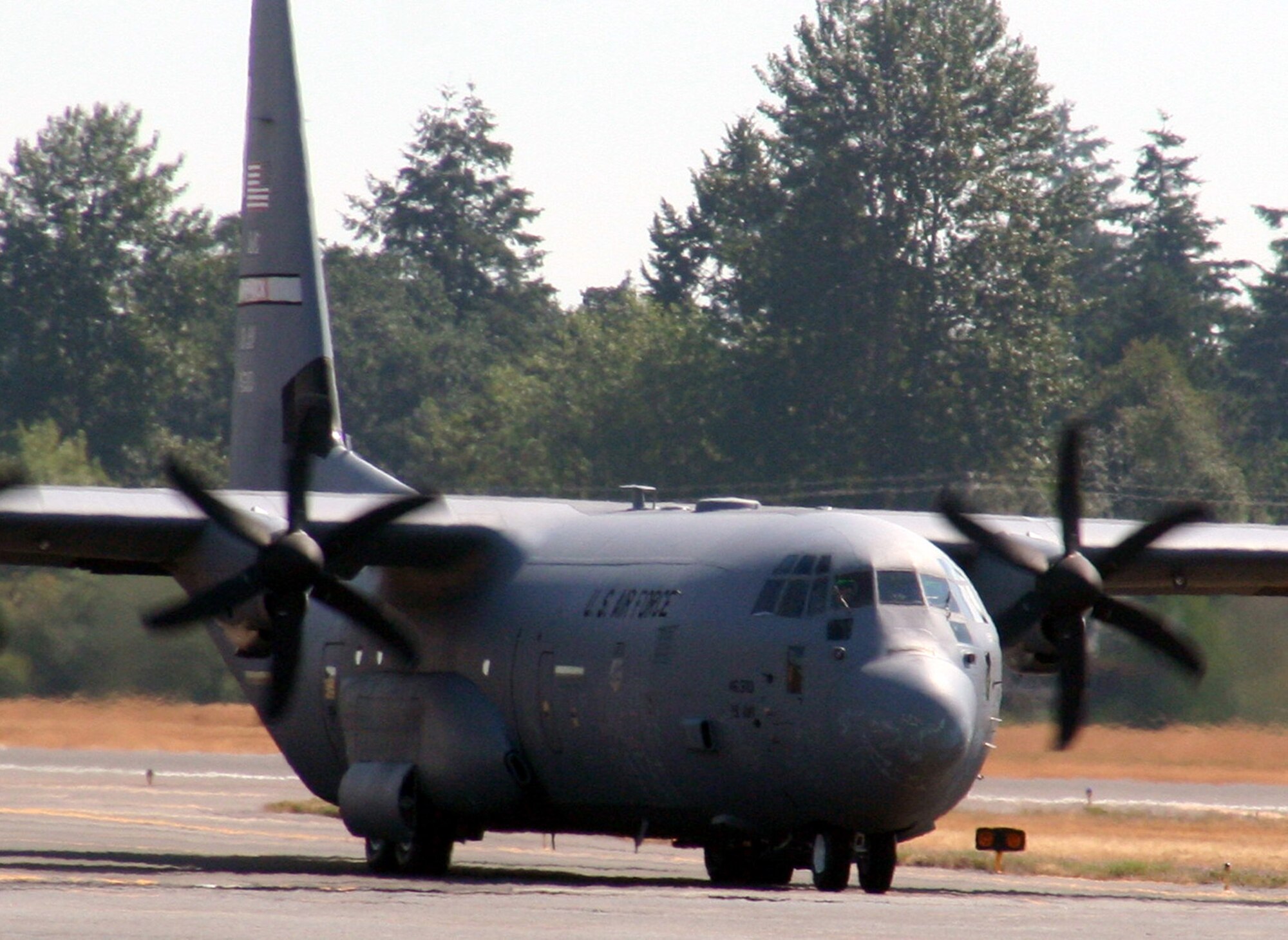 A C-130J Hercules from the 19th Airlift Wing, Little Rock Air Force Base, Ark., taxis for take-off for a mission at McChord AFB, Wash., July 25, 2009.  The C-130J is one of the Air Mobility Command's main airlift planes that helps provide "global reach" and the Air Force to "fly, fight and win...in air, space and cyberspace."  (U.S. Air Force Photo/Tech. Sgt. Scott T. Sturkol)