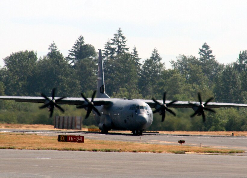 A C-130J Hercules from the 19th Airlift Wing, Little Rock Air Force Base, Ark., taxis for take-off for a mission at McChord AFB, Wash., July 25, 2009.  The C-130J is one of the Air Mobility Command's main airlift planes that helps provide "global reach" and the Air Force to "fly, fight and win...in air, space and cyberspace."  (U.S. Air Force Photo/Tech. Sgt. Scott T. Sturkol)