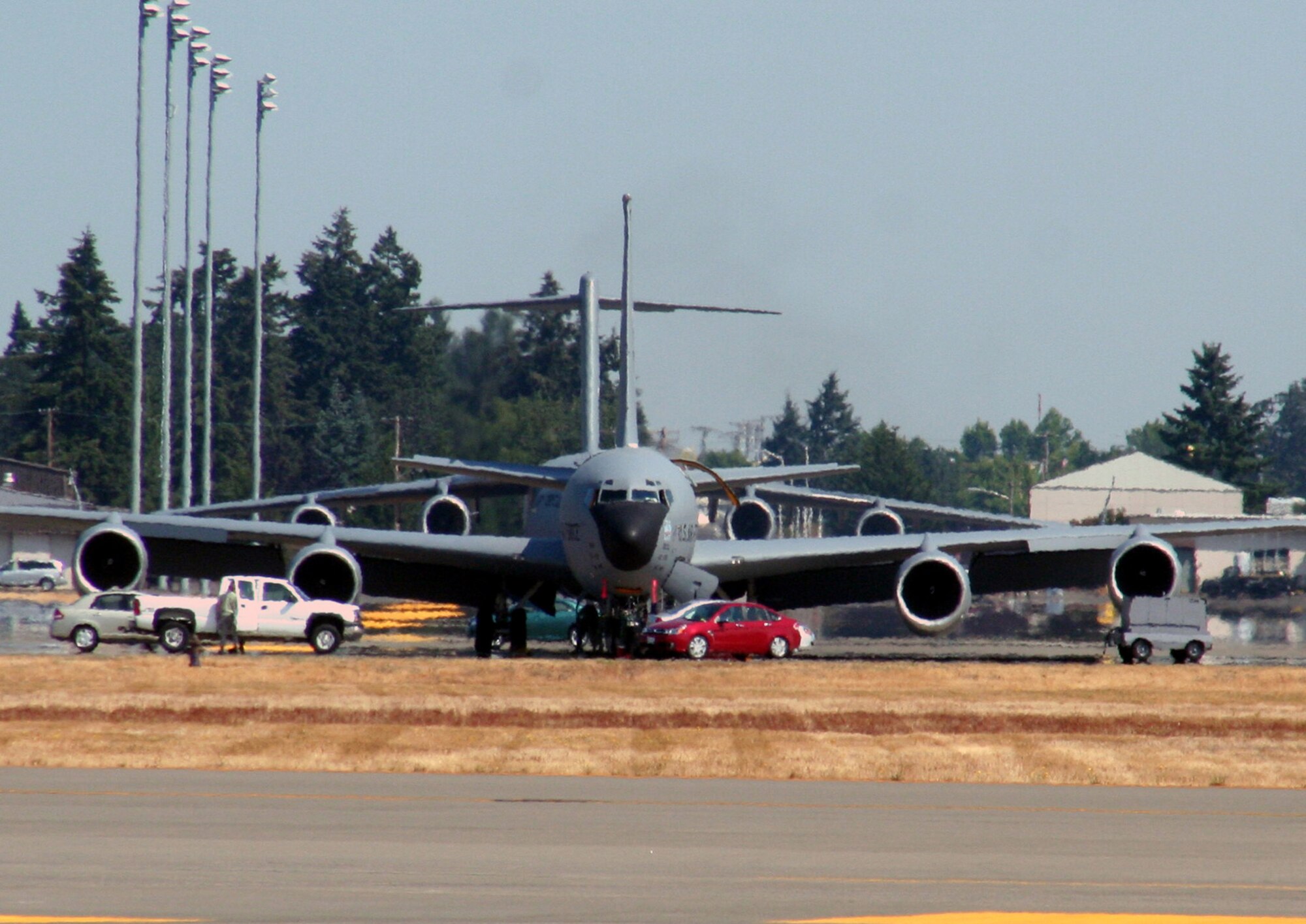 Airmen prepare a KC-135 Stratotanker for departure for a mission at McChord Air Force Base, Wash., July 25, 2009, for Air Mobility RODEO 2009.  The KC-135 is one of Air Mobility Command's main air refueling planes that helps provide "global reach" and the Air Force to "fly, fight and win...in air, space and cyberspace."  (U.S. Air Force Photo/Tech. Sgt. Scott T. Sturkol)
