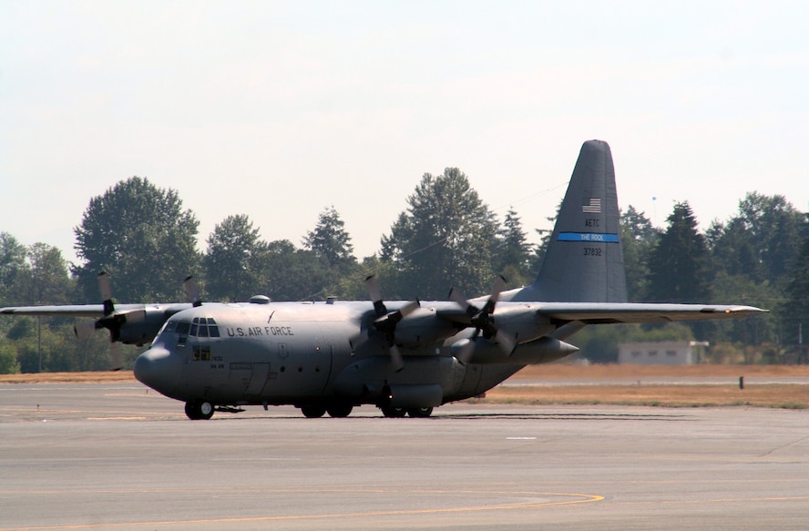 A C-130 Hercules from the 314th Airlift Wing, Little Rock Air Force Base, Ark., taxis for take-off for a mission at McChord AFB, Wash., July 25, 2009.  The C-130 is one of the Air Mobility Command's main airlift planes that helps provide "global reach" and the Air Force to "fly, fight and win...in air, space and cyberspace."  (U.S. Air Force Photo/Tech. Sgt. Scott T. Sturkol)
