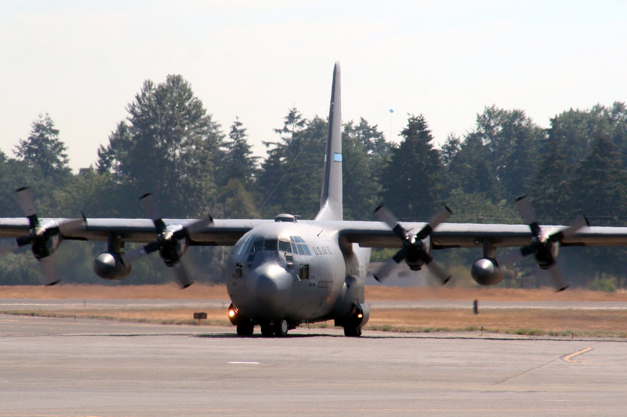 A C-130 Hercules from the 314th Airlift Wing, Little Rock Air Force Base, Ark., taxis for take-off for a mission at McChord AFB, Wash., July 25, 2009.  The C-130 is one of the Air Mobility Command's main airlift planes that helps provide "global reach" and the Air Force to "fly, fight and win...in air, space and cyberspace."  (U.S. Air Force Photo/Tech. Sgt. Scott T. Sturkol)