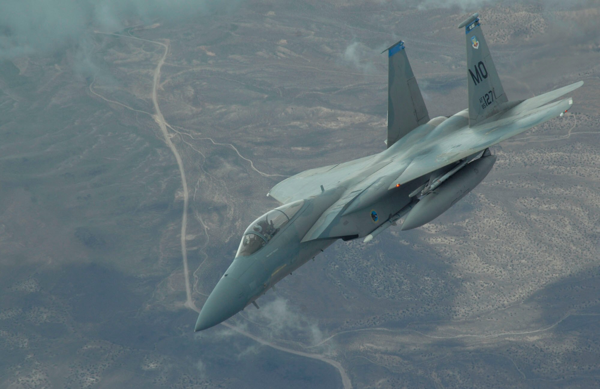 NELLIS AIR FORCE BASE, Nev. -- An F-15C Eagle from the 390th Fighter Squadron, Mountain Home Air Force Base, Idaho, heads out to the Nevada Test and Training range July 24 during Red Flag 09-4. Red Flag is a realistic combat training exercise involving the air forces of the United States and its allies. The exercise is conducted on the 15,000-square-mile Nevada Test and Training Range, north of Las Vegas. (U.S. Air Force photo by Master Sgt. Kevin J. Gruenwald)