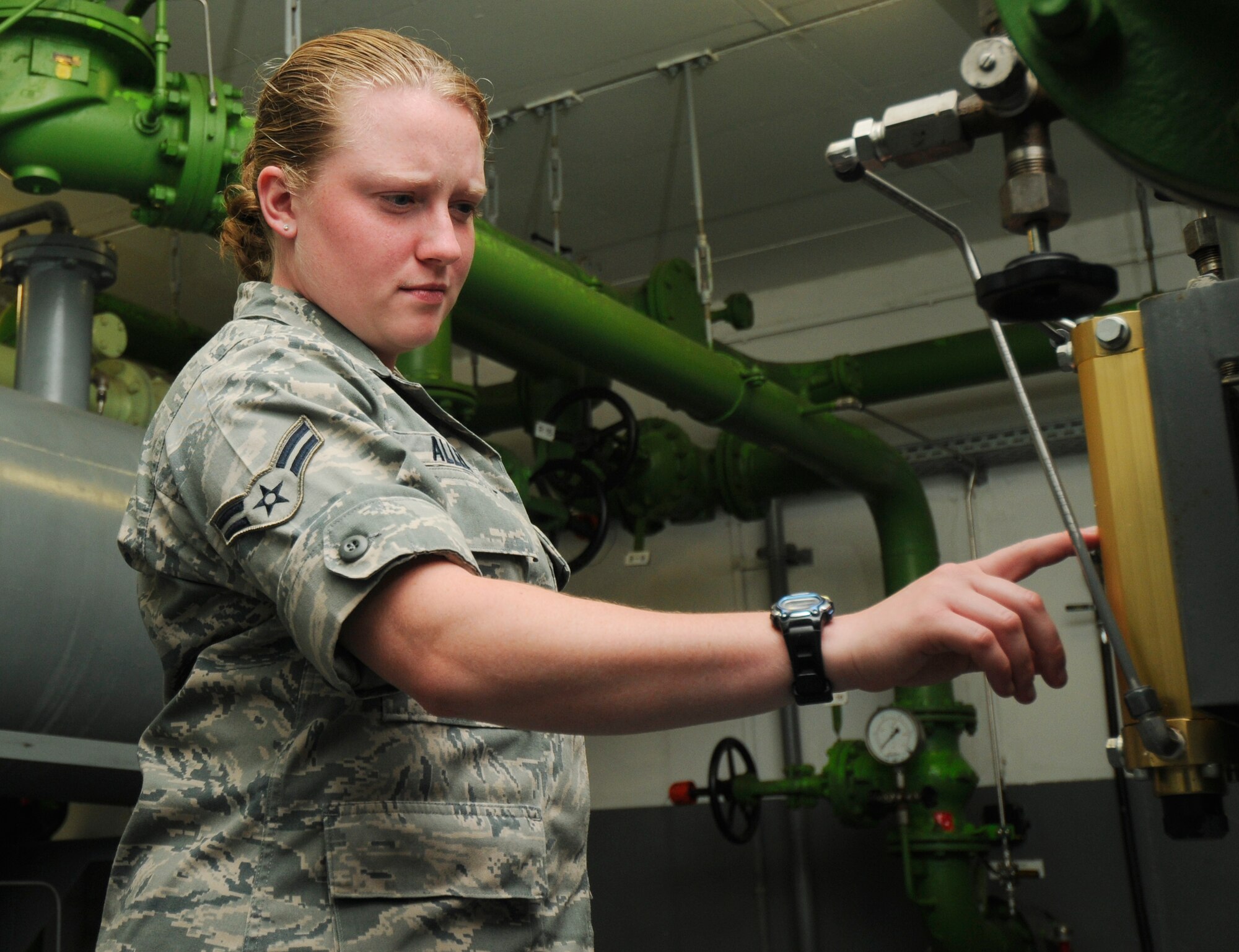 SPANGDAHLEM AIR BASE, Germany – Airman 1st Class Jennea Allen, 52nd Civil Engineer Squadron, inspects a differential pressure gauge in the filter room of Spangdahlem Air Base’s bulk storage area July 23. Gauges on this system are checked regularly to ensure the filter system is function properly and there is no water contaminating the fuel. The liquid fuels flight manages 2,300 meters of fuel pipeline, 23 underground fuel tanks and 8.2 million gallons of JP-8. (U.S. Air Force photo by Senior Airman Benjamin Wilson)