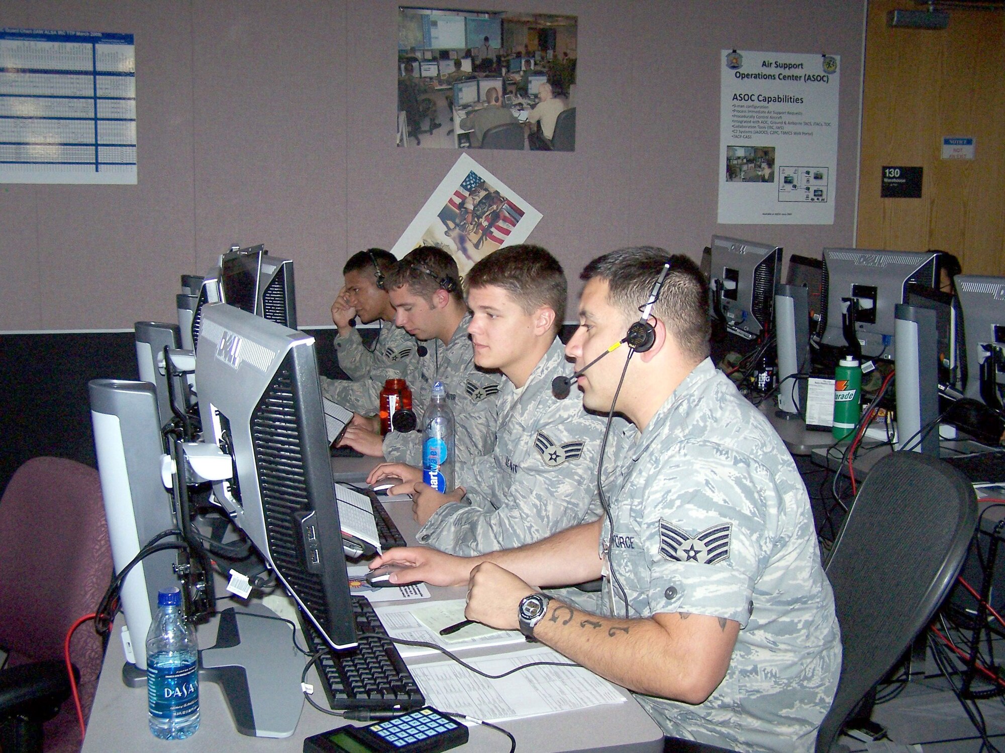 KIRTLAND AFB, N.M. -- Airmen work a scenario at the Air Support Operations Center simulator during VIRTUAL FLAG 09-3 on July 2. The exercise was facilitated by the 705th Combat Training Squadron in the Distributed Missions Operation Center at Kirtland Air Force Base. (U.S. Air Force photo/Noel Getlin) 
