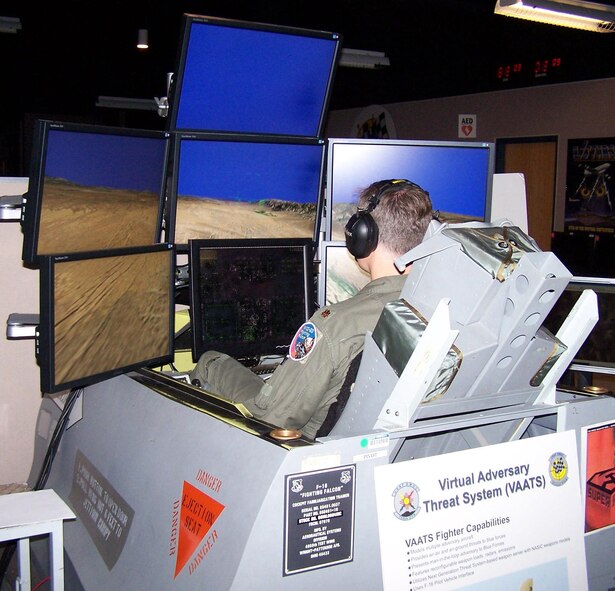 KIRTLAND AFB, N.M. -- Maj. Mike Shepherd, pilot and operations flight commander with the 64th Aggressor Squadron, uses a simulator to fly an SU-27 Soviet plane against an Air National Guard unit at the Distributed Missions Operation Center at Kirtland Air Force Base. The major was taking part in VIRTUAL FLAG 09-3 facilitated by the 705th Combat Training Squadron at Kirtland Air Force Base. (U.S. Air Force photo/Noel Getlin)