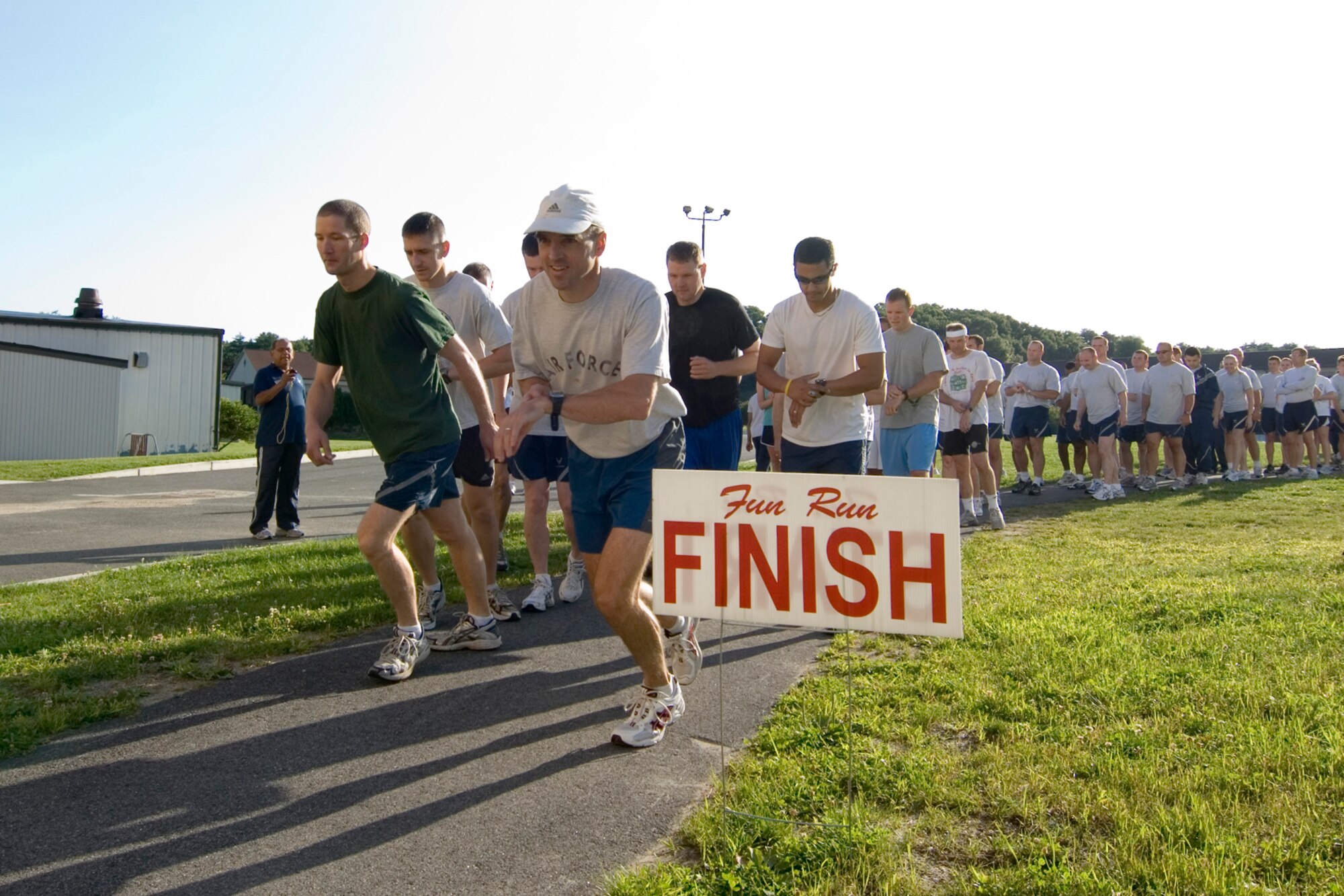 Runners totaling 86 from across the Hanscom community start the Firecracker 5K run held behind the Fitness and Sports Center July 15. The top male finisher was Lt. Col. Brian Ruhm with a time of 19:10 and the top female finisher was Bernadette Berger with a time of 25:40.  (U.S. Air Force photo by Rick Berry)