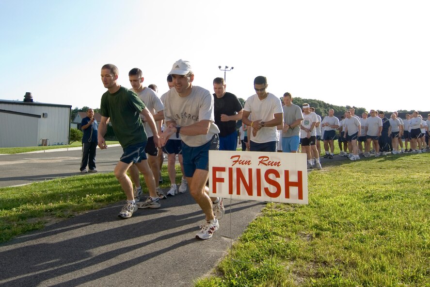 Runners totaling 86 from across the Hanscom community start the Firecracker 5K run held behind the Fitness and Sports Center July 15. The top male finisher was Lt. Col. Brian Ruhm with a time of 19:10 and the top female finisher was Bernadette Berger with a time of 25:40.  (U.S. Air Force photo by Rick Berry)
