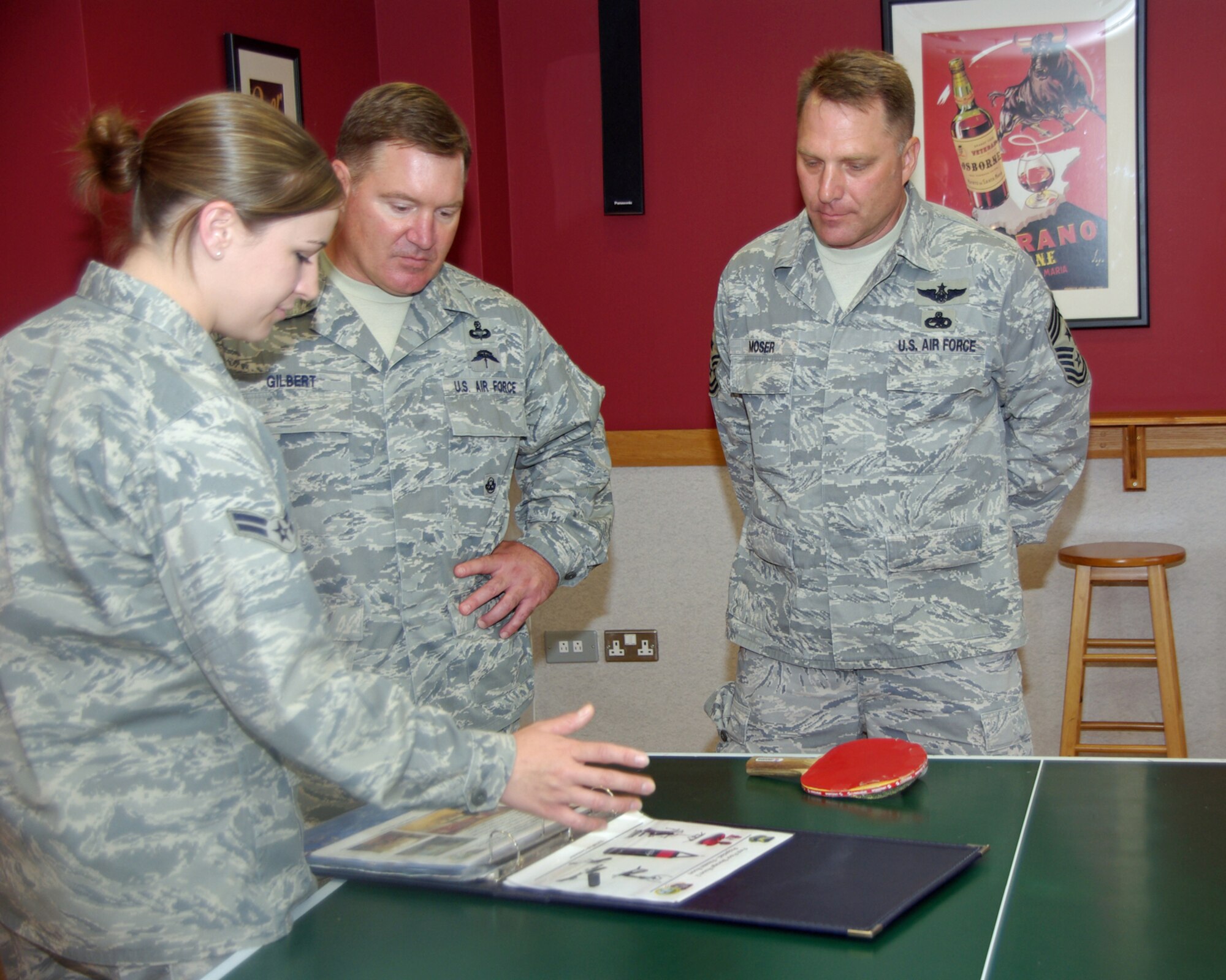 RAF MILDENHALL, England -- Chief Master Sgts. Michael Gilbert, Air Force Special Operations Command command chief, and Jeffrey Moser, 352nd Special Operations Group command chief, receive a briefing from Airman 1st Class Amanda Ryzenga, 352nd SOG dorm council president, on the state of affairs of the group dorm and proposed enhancements.  352nd SOG personnel are currently housed primarily in Bldg. 215, which has undergone vast improvements that did not go unnoticed by Chief Gilbert.  “You’ve exceeded my expectations…you guys are definitely running a model dorm,” he said.  (U.S. Air Force photo by Tech. Sgt. Marelise Wood)
 
