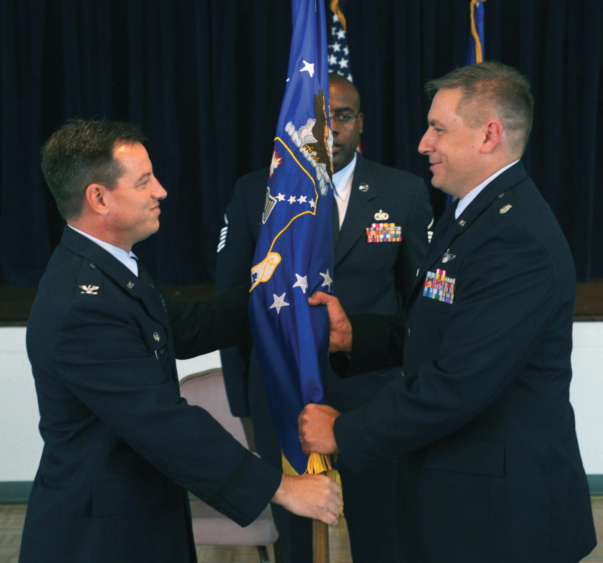 Lieutenant Col. Kevin Hubbard assumes command of the Civil Air Patrol-United States Air Force Middle East Liaison Region command from Col. William Ward, CAP-USAF commander, Maxwell AFB, Ala., during a change of command ceremony at the Andrews Community Activity Center July 17. Colonel Hubbard and his team will provide guidance, assistance and oversight to the Civil Air Patrol organizations within the region to include Maryland, Delaware, North and South Carolina, Virginia, and West Virginia. (U.S. Air Force photo/ Senior Airman Steven R. Doty)