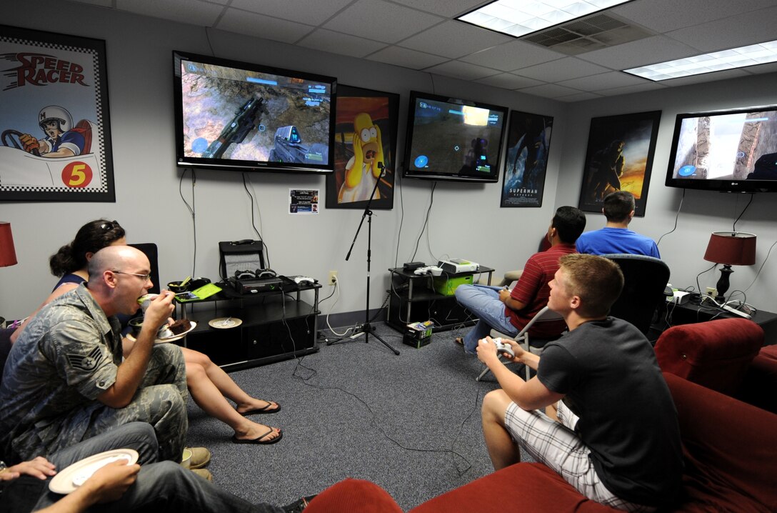 LANGLEY AIR FORCE BASE, Va. -- Langley Airmen challenge each other in a Halo video game tournament at the new location for the Eagle's Wing during the re-opening ceremony July 23. The Eagle's Wing is considered a "safe haven" for many Airmen looking for a place to eat, hang out, attend Bible studies, and interact with others through video games and poker nights. (U.S. Air Force photo/Airman Rebecca Montez)