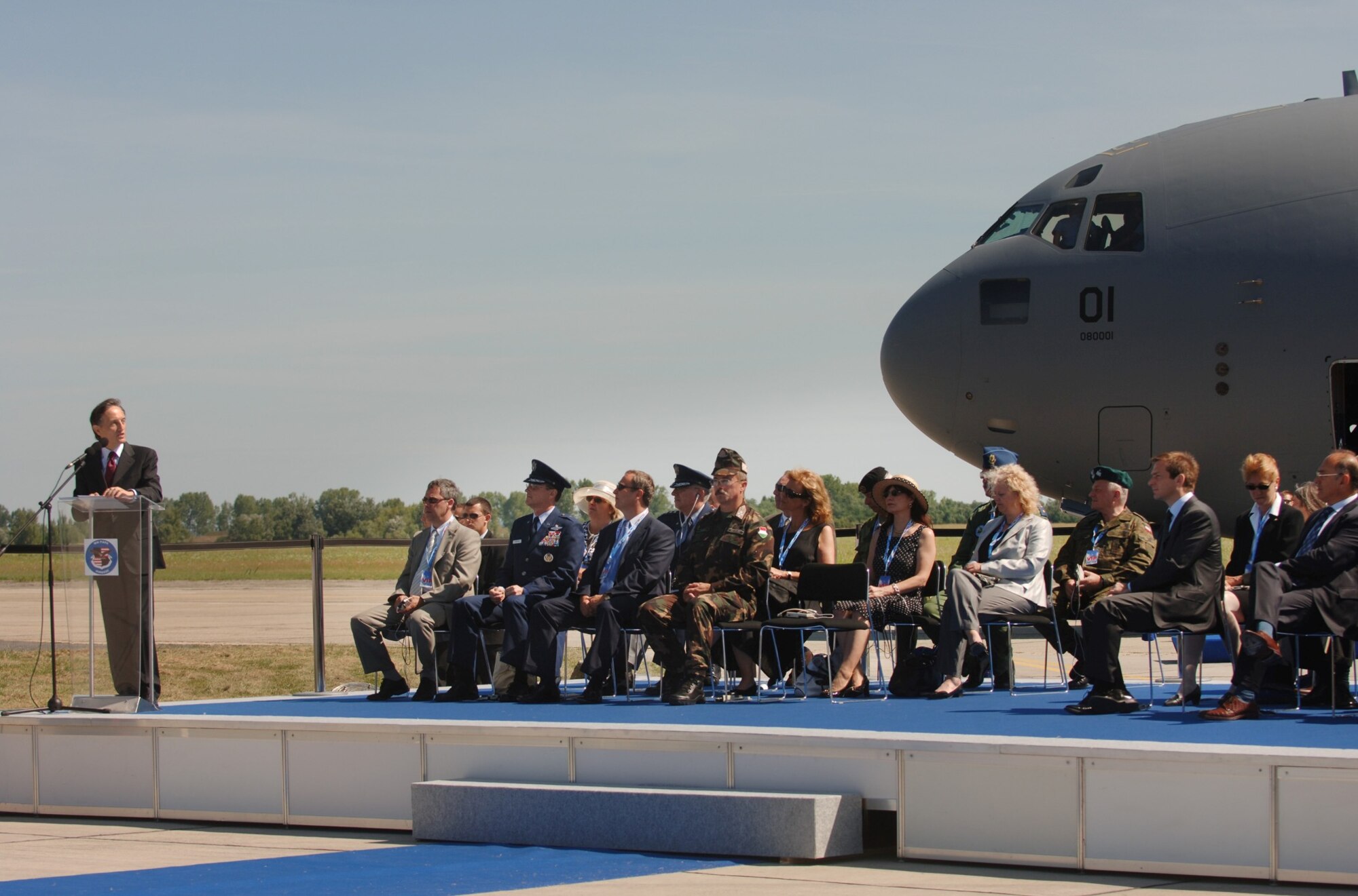 PAPA AIR BASE, Hungary--Ambassador Claudio Bisogniero, NATO deputy secretary general, speaks during the official activation ceremony of a first-of-its-kind multinational Heavy Airlift Wing at Papa Air Base, Hungary, on July 27. The ceremony celebrates the efforts of the 12 nations who, over the last 10 months, stood up the organization that will provide strategic airlift worldwide for humanitarian, disaster relief, and peacekeeping missions in support of the European Union, United Nations and NATO. (Department of Defense photo/Master Sgt. Scott Wagers)