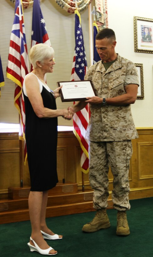 Jeanne R. Hawthorne recently received an award for her “outstanding service and professional accomplishments” while she served as the Deputy Director for Operations and Training with Marine Corps Installations – East and Marine Corps Base Camp Lejeune from January 1997 through December 2008. The award ceremony was held July 29, on the Commanding General’s Quarterdeck in Lejeune Hall where Col. Richard P. Flatau Jr., the base commander, presented Hawthorne the Superior Civil Service Award for her many years of service.::n::