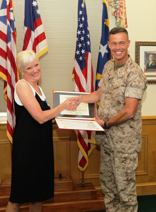 Jeanne R. Hawthorne recently received an award for her “outstanding service and professional accomplishments” while she served as the Deputy Director for Operations and Training with Marine Corps Installations – East and Marine Corps Base Camp Lejeune from January 1997 through December 2008. The award ceremony was held July 29, on the Commanding General’s Quarterdeck in Lejeune Hall where Col. Richard P. Flatau Jr., the base commander, presented Hawthorne the Superior Civil Service Award for her many years of service.::n::