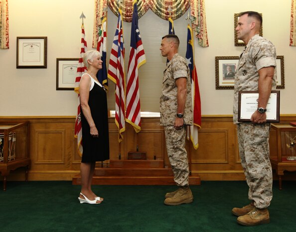 Jeanne R. Hawthorne recently received an award for her “outstanding service and professional accomplishments” while she served as the Deputy Director for Operations and Training with Marine Corps Installations – East and Marine Corps Base Camp Lejeune from January 1997 through December 2008. The award ceremony was held July 29, on the Commanding General’s Quarterdeck in Lejeune Hall where Col. Richard P. Flatau Jr., the base commander, presented Hawthorne the Superior Civil Service Award for her many years of service.::n::