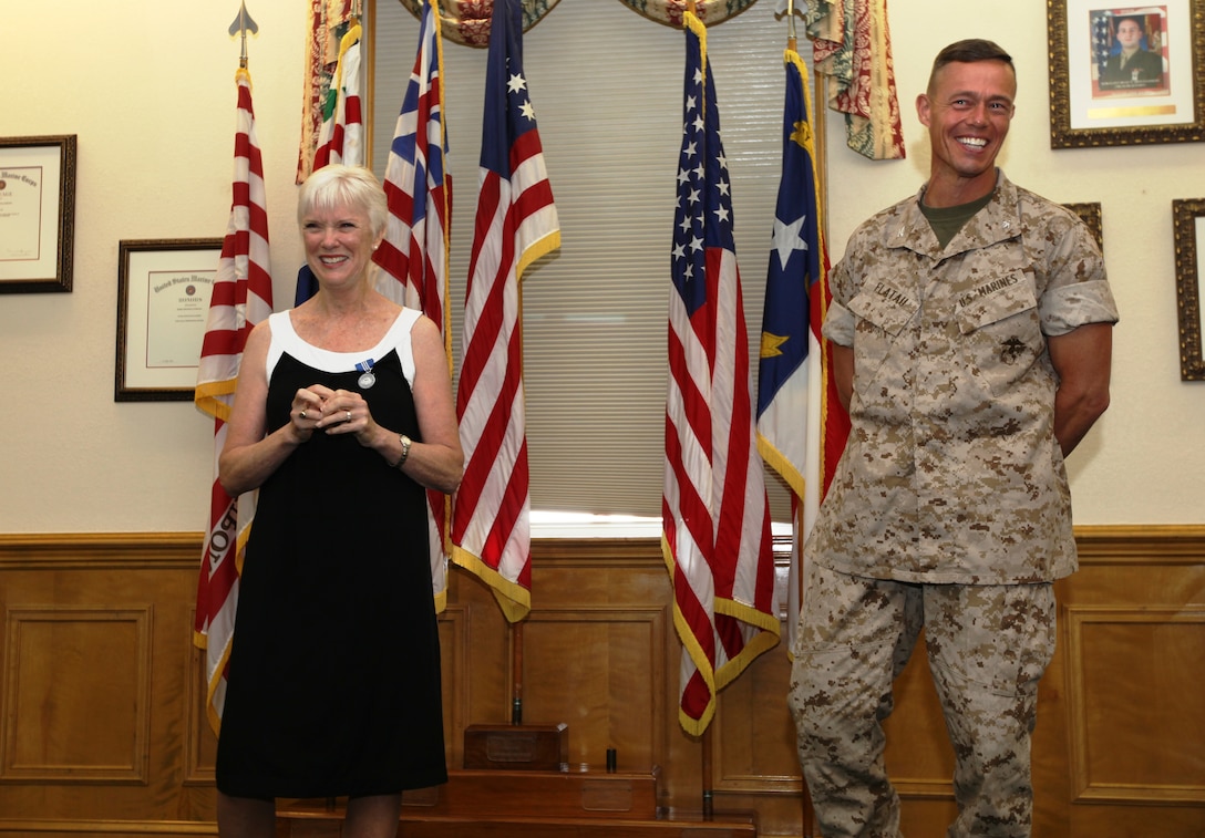 Jeanne R. Hawthorne recently received an award for her “outstanding service and professional accomplishments” while she served as the Deputy Director for Operations and Training with Marine Corps Installations – East and Marine Corps Base Camp Lejeune from January 1997 through December 2008. The award ceremony was held July 29, on the Commanding General’s Quarterdeck in Lejeune Hall where Col. Richard P. Flatau Jr., the base commander, presented Hawthorne the Superior Civil Service Award for her many years of service.::n::