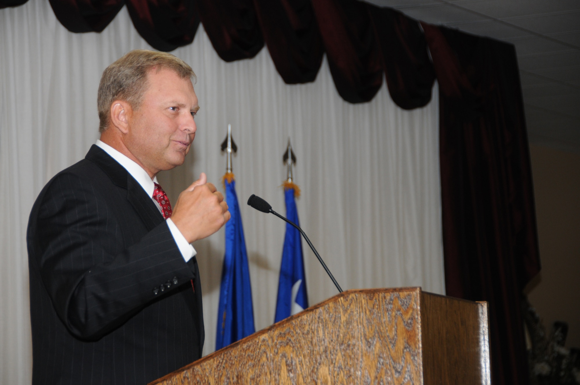 Retired Lt. Gen. Michael Peterson speaks at the July 20 promotion ceremony at which he administered the oath of office to Brig. Gen. Ian Dickinson, 81st Training Wing commander.  General Peterson, who retired Feb. 1, was the wing’s commander from May 2002 to April 2004.  (U.S. Air Force photo by Kemberly Groue)