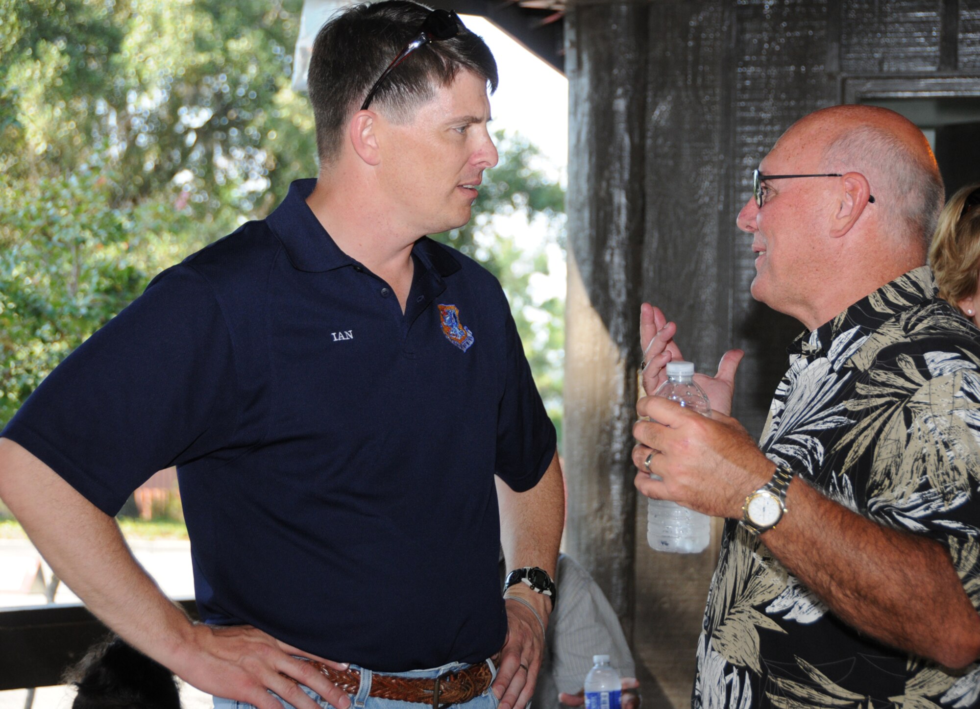 Brig. Gen. Ian Dickinson, 81st Training Wing commander, chats with his friend, Col. Tony Faughn, at a reception at marina park after his promotion ceremony, July 20.  Colonel Faughn, who attended the promotion with his wife, Katie, is director of communications for Air Force Special Operations Command at Hurtlburt Field, Fla.  (U.S. Air Force photo by Kemberly Groue)