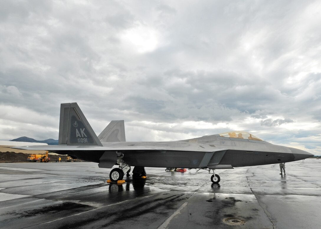 An F-22 Raptor pilot faces a rainy day of flying July 27 during Red Flag-Alaska at Elmendorf Air Force Base, Alaska. Red Flag is a field training exercise for U.S. coalition forces that provides joint offensive counter-air, interdiction close air support, and large force employment training in a simulated combat environment. Participating bases include Elmendorf and Eielson Air Force bases, Alaska, and Osan Air Base, South Korea. (U.S. Air Force photo/Senior Airman Laura Turner)