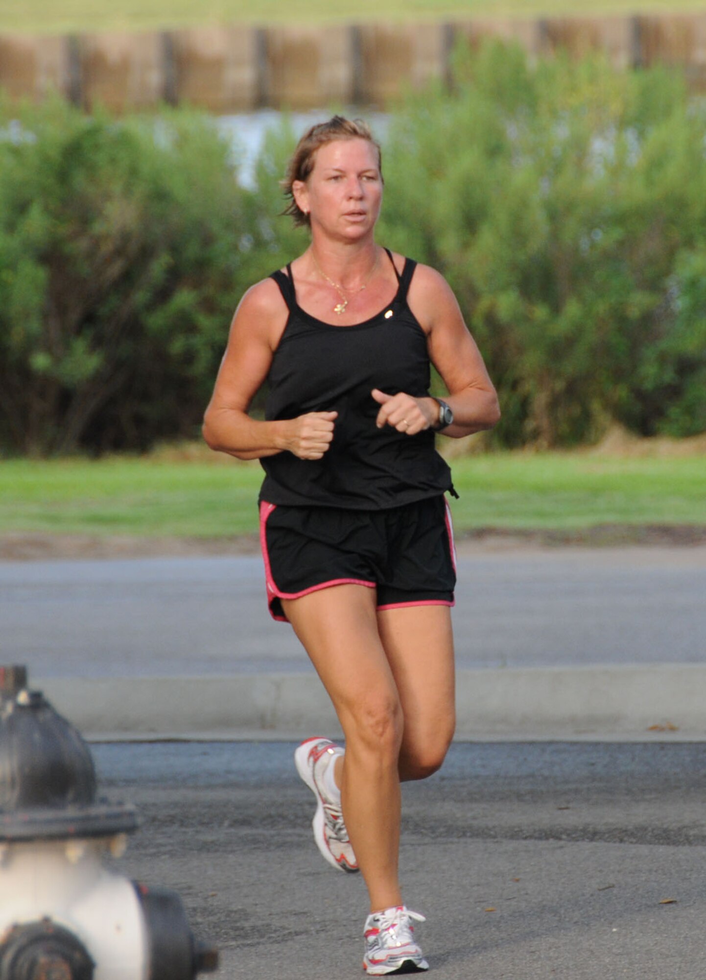 Peggy Cuevas, with a time of 27:28 was the top female finisher in the Sexual Assault Prevention and Response 5-kilometer run, July 23.  Cuevas is the Seabee Base’s sexual assault response coordinator.  (U.S. Air Force photo by Kemberly Groue)