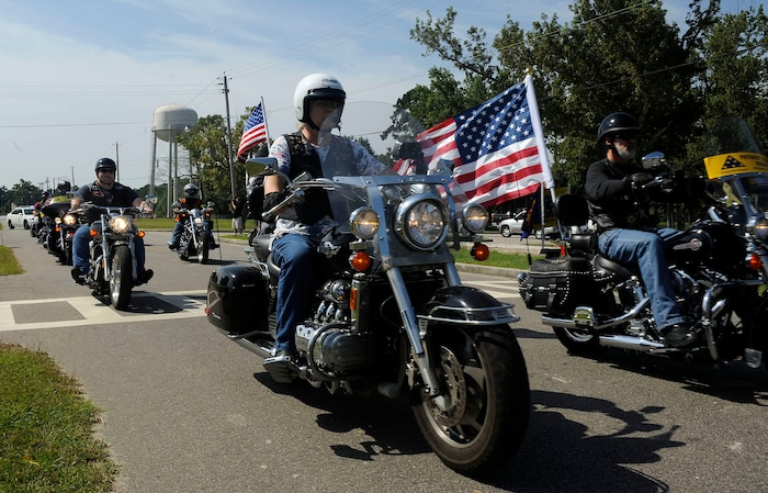 Members of the Patriot Guard Riders lead the procession after a memorial service for a military working dog who died of lyphoma held at Charleston AFB July 24. The memorial service was held for Military Working Dog Cigan C071, who died at the age of 10. Cigan was assigned to Charleston AFB in 2001 and was recently training with his handler, Staff Sgt. Justin Langley, for a deployment to Afghanistan. (U.S. Air Force photo/Airman 1st Class Alex Hoachlander)