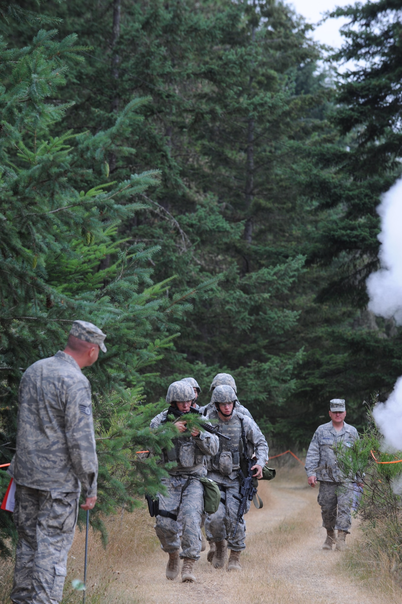 MCCHORD AIR FORCE BASE, Wash. -- Members from Team McConnell’s RODEO security forces team walk the competition route while umpires evaluate their responses to scenarios during the RODEO combat weapons competition July 22 at McChord AFB, Wash. (Photo by Tech. Sgt. Chyrece Campbell)  