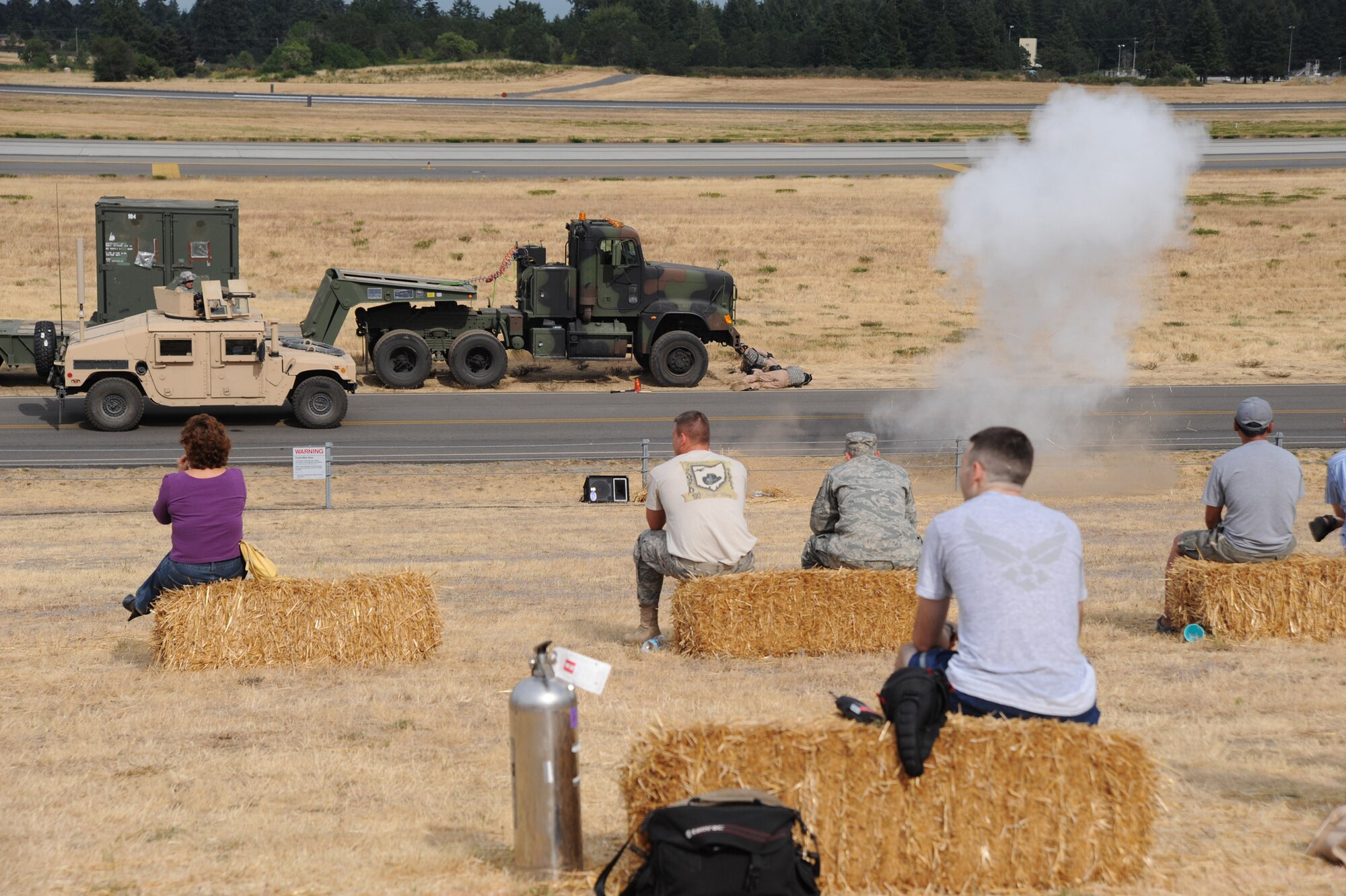 MCCHORD AIR FORCE BASE, Wash. -- Spectators watch security forces team members perform a demonstration of convoy tactics during RODEO at McChord AFB, Wash.  (Photo by Tech. Sgt. Chyrece Campbell)