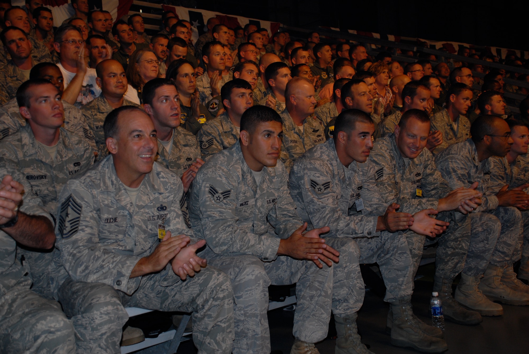 MCCHORD AIR FORCE BASE, Wash. – 515th Air Mobility Operations Wing Pacific aerial porters and Command Chief Master Sgt. Justin Ouchie, left, await the results of the Air Mobility Rodeo 2009 July 24 here. Their team of eight aerial porters from six squadrons around the Pacific trained at Hickam Air Force Base, Hawaii, for seven weeks prior to the Rodeo. Flight crew members, maintainers, security forces, and joint airdrop inspection specialists here competed against more than 100 teams and 2,500 people from the Air Force and allied nations at this biennial, international competition July 19-24 at McChord Air Force Base, Wash. The units competed in events that tested and judged every aspect of their career fields' core competencies. The Rodeo is designed to demonstrate air mobility mission capabilities, seek out new tactics, techniques, and procedures that improve mission results, increase esprit de corps both among competing teams and internationally, and build standardization and safety. (U.S. Air Force photo/Staff Sgt. Carolyn Viss) 