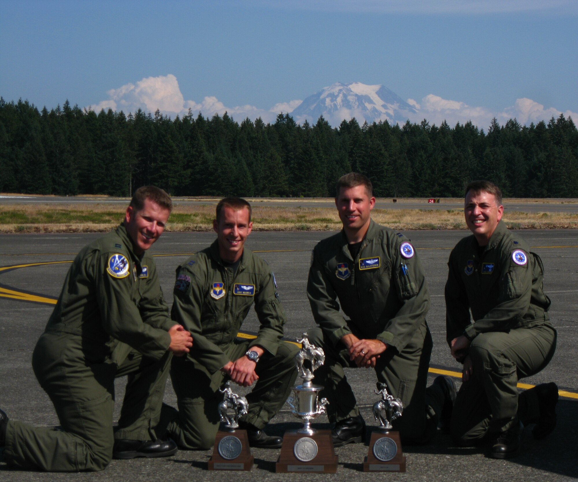 LAUGHLIN AIR FORCE BASE, Texas--Captains Aaron Gill, Aric Wagner, Richard Galsterer, 86th Flying Training Squadron, and their squadron commander, Lt. Col. John Cinnamon, pose with the trophies they won during Air Mobility Command's 2009 Rodeo at McChord Air Force Base, Wash., recently.  The team swept the board winning all the Air Education and Training Command's portion of the Rodeo.  (Courtesy photo )    