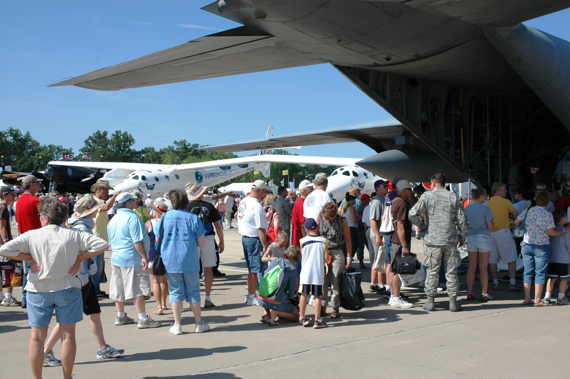 Spectators gather July 29 to see the Air Force Reserve's Modular Airborne Firefighting System, or 'MAFFS II,' at the 2009 Experimental Aircraft Association AirVenture air show in Oshkosh, Wis. The AF Reserve's 302nd Airlift Wing participated in this year's air show by demonstrating the new MAFFS II capabilities on July 27 with a live air drop. The air show is known as the world's greatest aviation celebration and attracts hundreds of thousands of aviation enthusiasts from all over the world. The C-130, assigned to the 302nd AW at Peterson Air Force Base, Colo., is equipped with the new MAFFS II system and is on display at EAA AirVenture through July 29. (U.S. Air Force photo/Capt. Jeff Schoen)