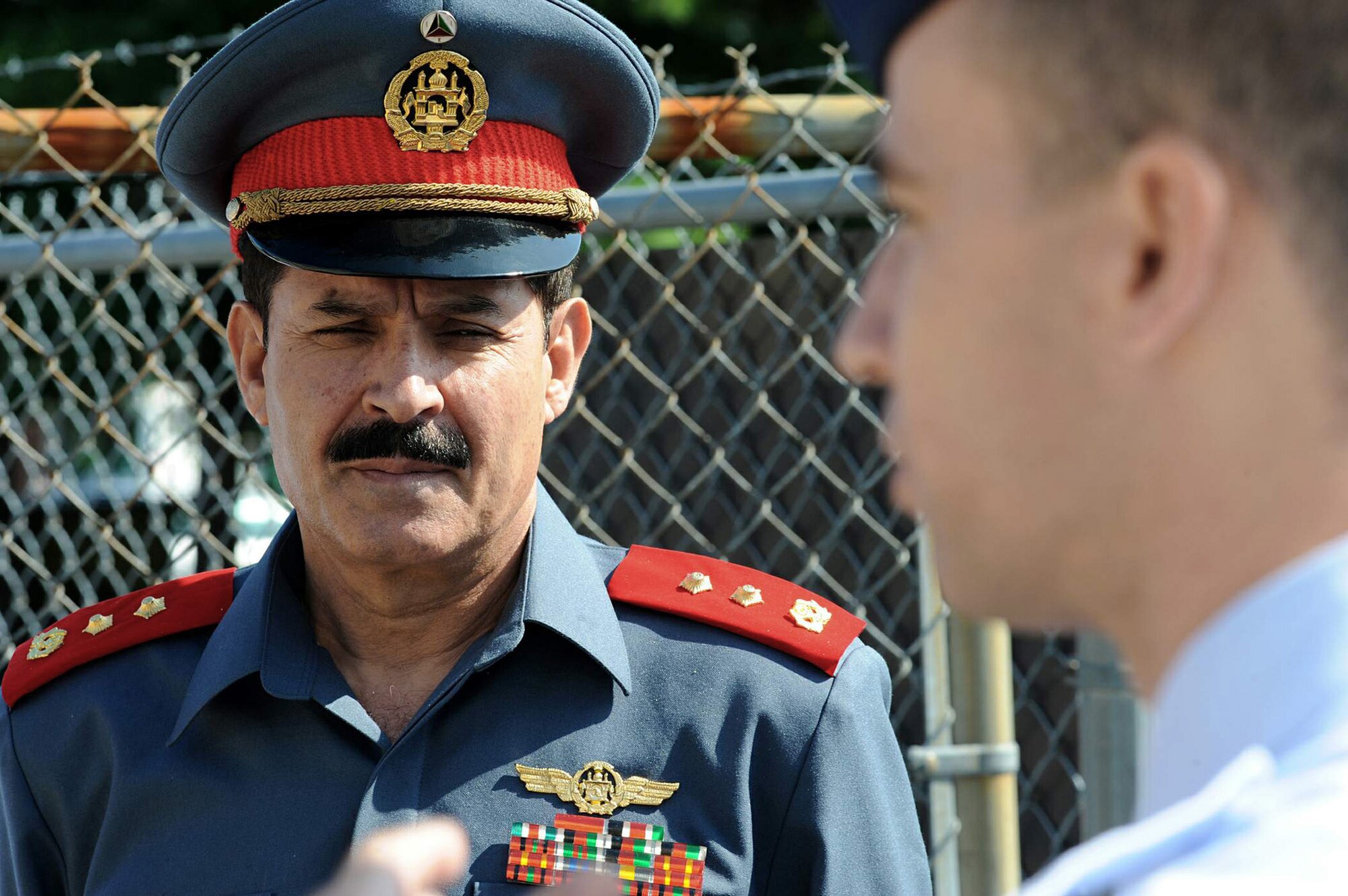 Afghan Maj. Gen. Mohammad Dawran listens as Master Sgt. Charles Sherman explains the Mobile Command and Control system July 13 at the Air Force Expeditionary Center on Joint Base McGuire-Dix-Lakehurst, N.J. General Dawran, commander of the Afghanistan National Army Air Corps, visited the installation to learn more about the Air Education and Training Command's Air Adviser Course housed at the Expeditionary Center on Fort Dix. Sergeant Sherman is the Mobility Air Forces Mobile Command and Control Leadership Course director. (U.S. Air Force photo/Staff Sgt. Nathan G. Bevier) 
