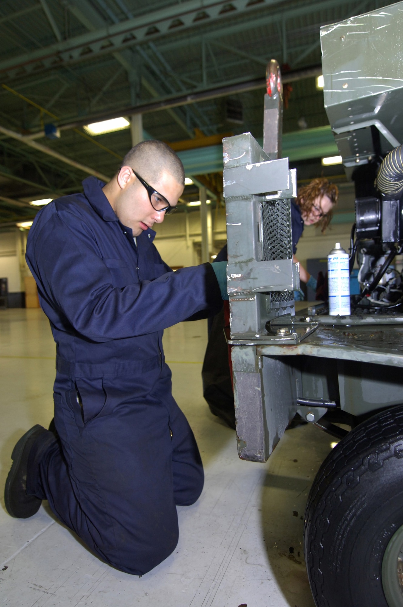 MINOT AIR FORCE BASE, N.D.-- Airman 1st Class Michael Monge-Sansone, 5th Maintenance Squadron Aerospace Ground Equipment (AGE) technician, oils a dash 95 large air start system here, July 27.  The AGE flight recently initiated an Air Force Smart Operations 21 process to increase the unit’s efficiency to meet the base’s mission.  The $325.00 cost investment is expected to yield a return of 60 saved man hours weekly and over $1 million annually.   (U.S. Air Force photo by Tech. Sgt.  Lee A. Osberry Jr.)