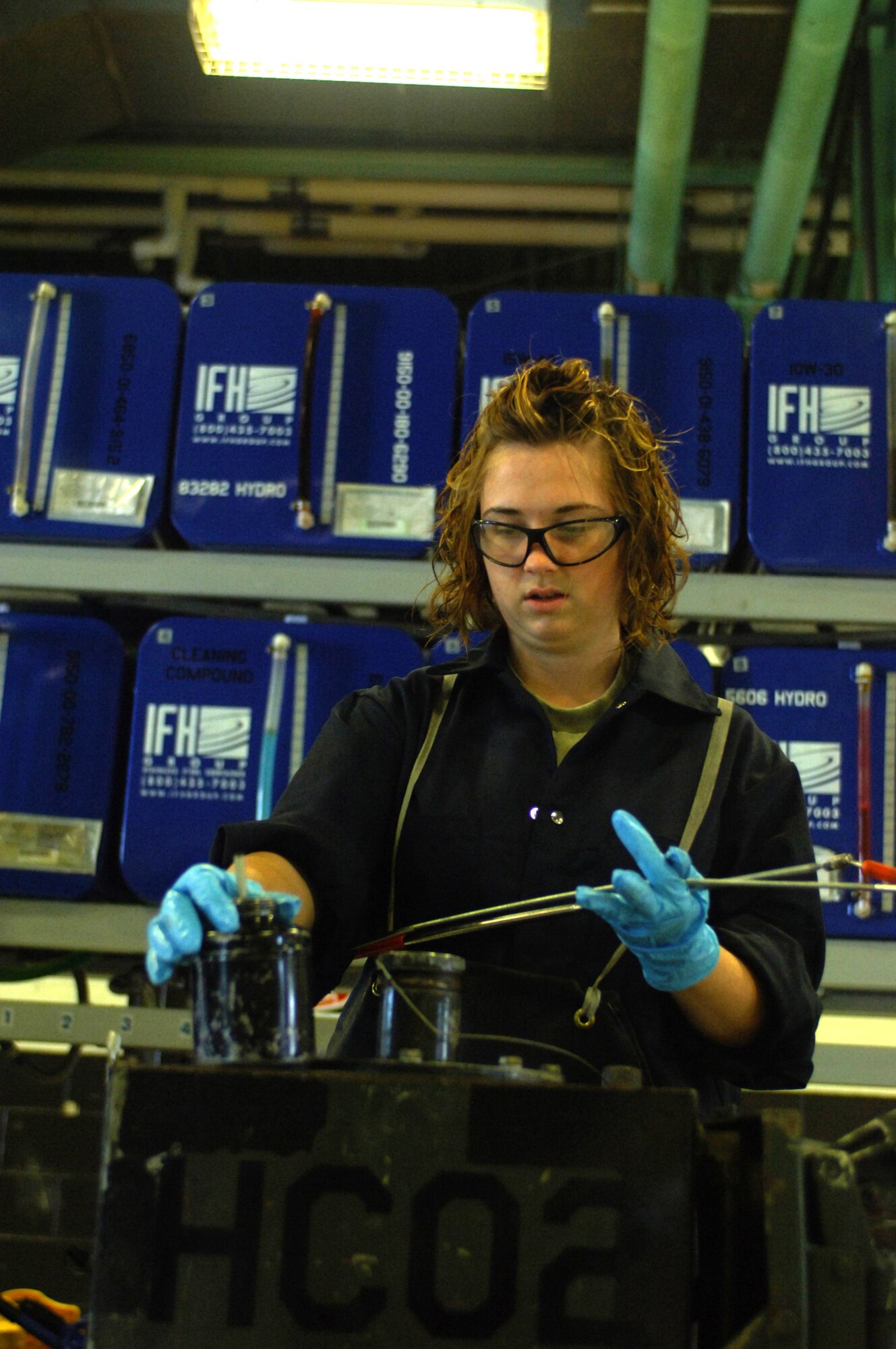 MINOT AIR FORCE BASE, N.D.-- Airman 1st Class Jodi Ebnit, 5th Maintenance Squadron Aerospace Ground Equipment (AGE) technician, checks the oil level on a dash 95 large air start system here, July 27.  The AGE flight recently initiated an Air Force Smart Operations 21 process to increase the unit’s efficiency to meet the bases mission.  The $325.00 cost investment is expected to yield a return of 60 saved man hours weekly and over $1 million annually.   (U.S. Air Force photo by Tech. Sgt.  Lee A. Osberry Jr.)