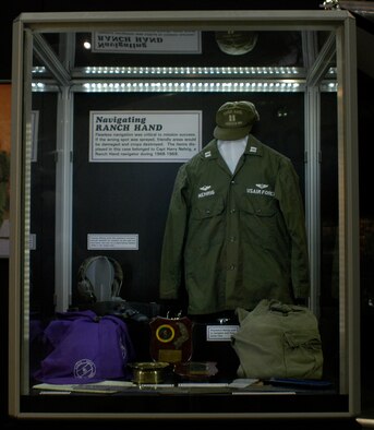 DAYTON, Ohio - Items in the Navigating Ranch Hand case, including an aircraft headset, stopwatch, map, ashtray, plaque and navigation instruments, on display in the Down in the Weeds: Ranch Hand exhibit in the Southeast Asia War Gallery at the National Museum of the U.S. Air Force. (U.S. Air Force photo)