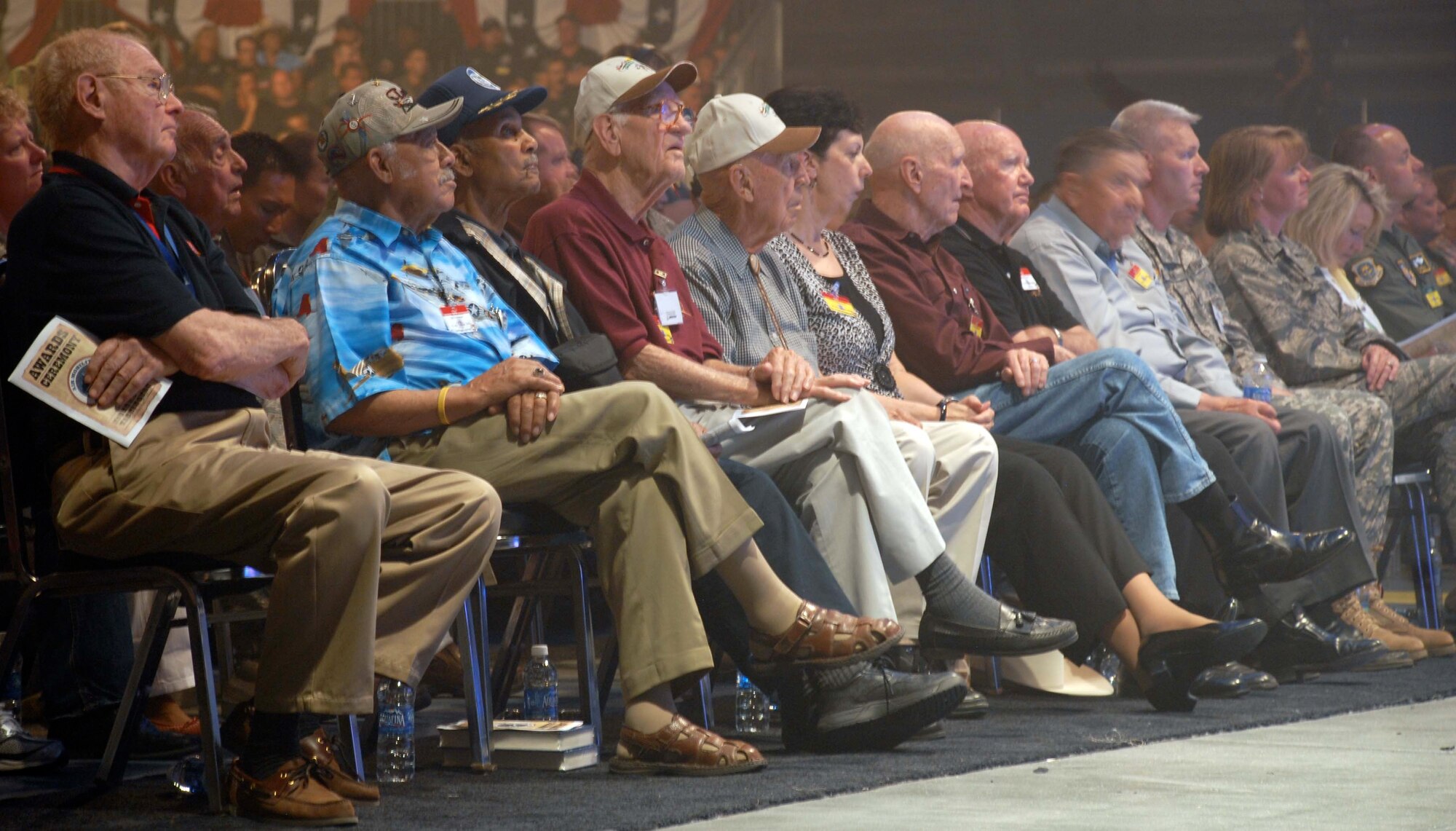 MCCHORD AIR FORCE BASE, Wash. – Distinguished visitors and Air Mobility Rodeo 2009 spectators, including retired Col. Gail Halvorsen, the famous Berlin Airlift “Candy Bomber” known as Uncle Wiggly Wings observe the closing ceremonies here July 24. The biennial Rodeo, held July 19-24, is designed to demonstrate air mobility mission capabilities, seek out new tactics, techniques, and procedures that improve mission results, increase esprit de corps both among competing teams and internationally, and build standardization and safety. (U.S. Air Force photo/Staff Sgt. Carolyn Viss) 