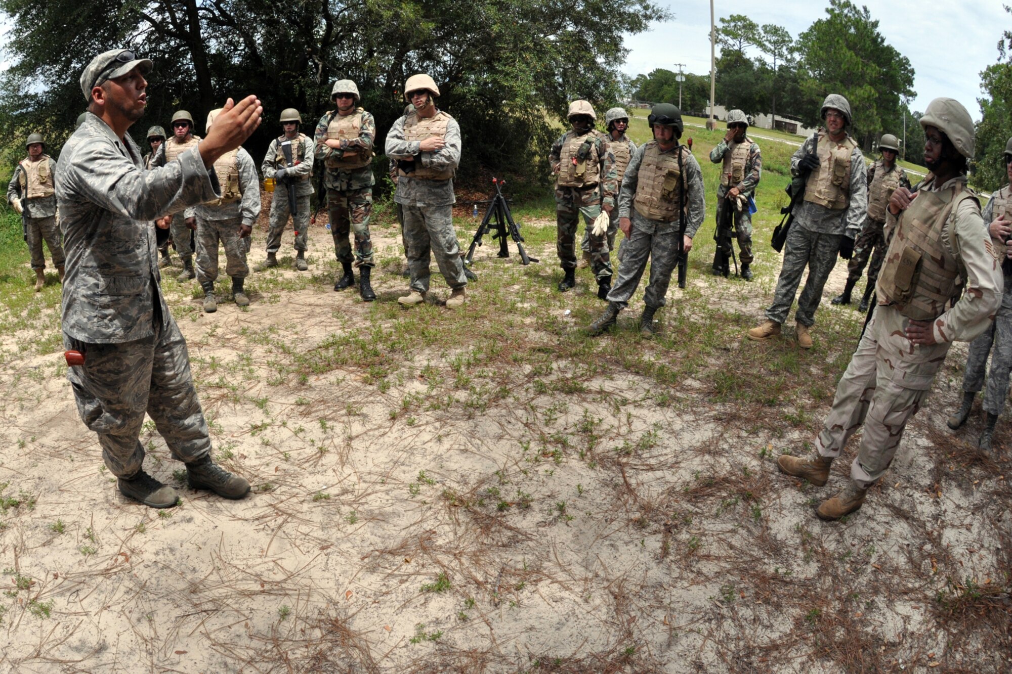 EGLIN AIR FORCE BASE, Fla. – Esteban Ruiz, 96th Security Forces Squadron Combat Skills Training instructor, critiques Airmen during CST here, July 28. CST is a course that covers everything from use of deadly force to salute reporting and is required for most members as a refresher to prepare them for situations they may encounter in theatre. (U.S. Air Force photo/ Airman Anthony Jennings)