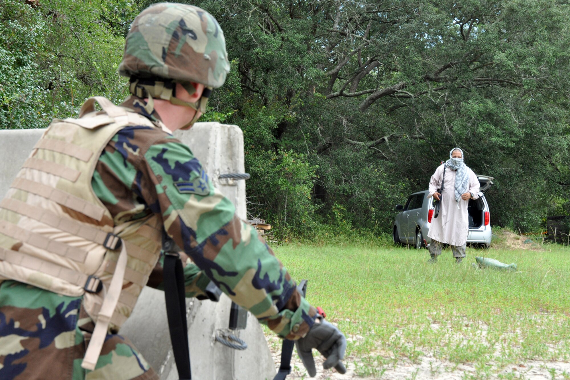 EGLIN AIR FORCE BASE, Fla. – An Airman rehearses challenging techniques while in a defense fighting position during Combat Skills Training here, July 28. CST is a course that covers everything from use of deadly force to salute reporting and is required for most members as a refresher to prepare them for situations they may encounter in theatre. (U.S. Air Force photo/ Airman Anthony Jennings)