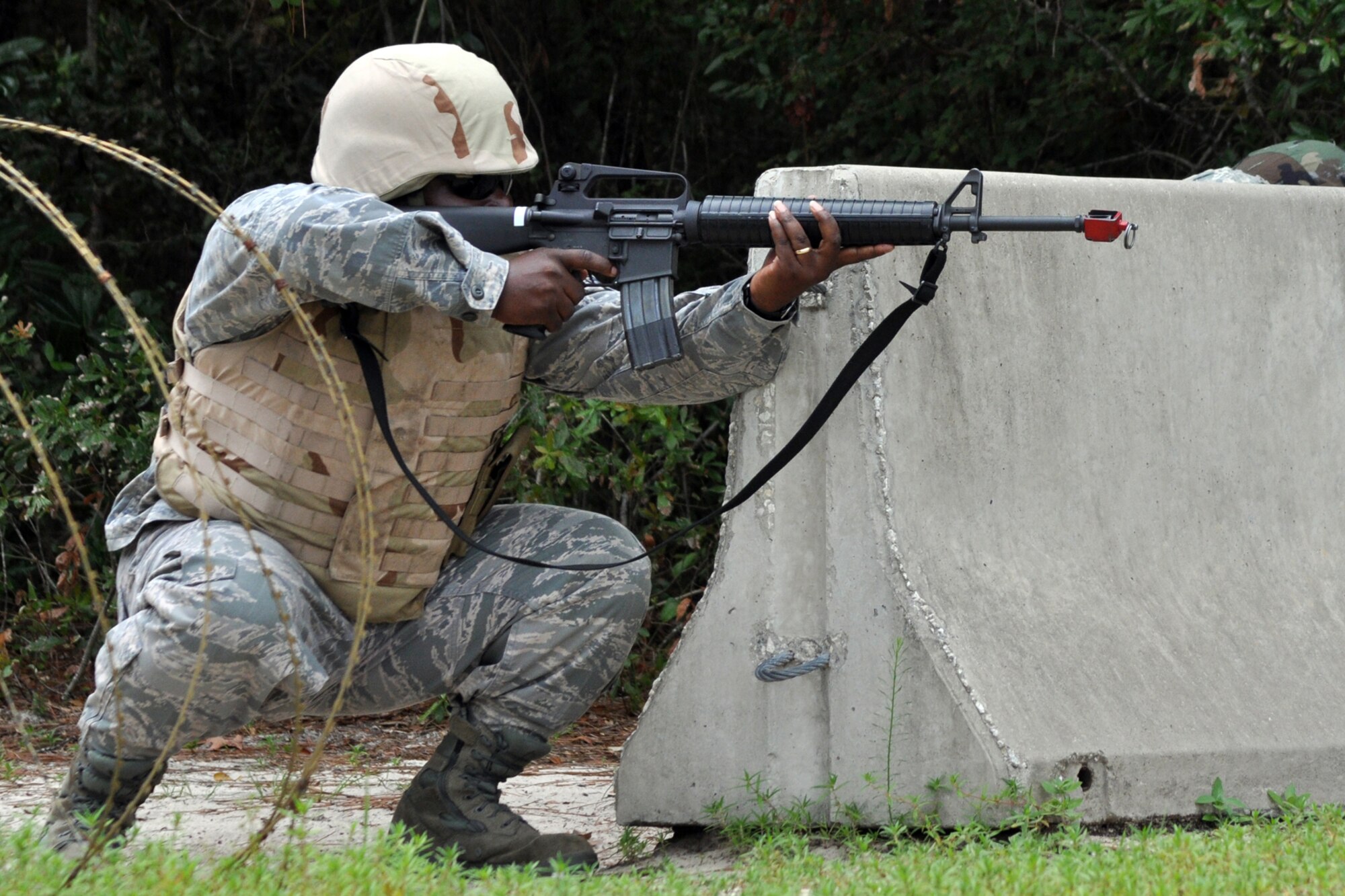 EGLIN AIR FORCE BASE, Fla. – Tech. Sgt. Robert Hadley, 96th Force Support Squadron, rehearses challenging techniques while in a defense fighting position during Combat Skills Training here, July 28. CST is a course that covers everything from use of deadly force to salute reporting and is required for most members as a refresher to prepare them for situations they may encounter in theatre. (U.S. Air Force photo/ Airman Anthony Jennings)
