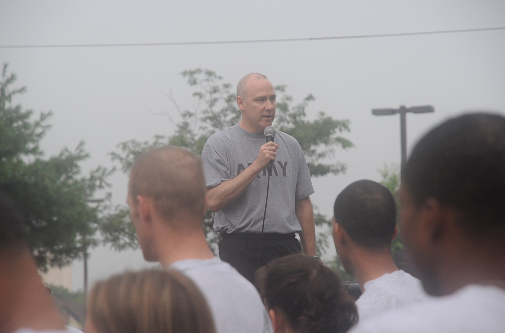 Army Col. Joe Poth, 87th Air Base Wing and Joint Base McGuire-Dix-Lakehurst deputy commander, offers a motivational speech to Airmen of the 87th ABW and 305th Air Mobility Wing before the monthly Warrior Run July 29. It was the first time the colonel led the run since he arrived at the joint base. According to base leadership, physical fitness should be a top priority for all servicemembers - especially in light of upcoming changes to the Air Force PT program. (U.S. Air Force photo/Staff Sgt. Danielle Johnson)