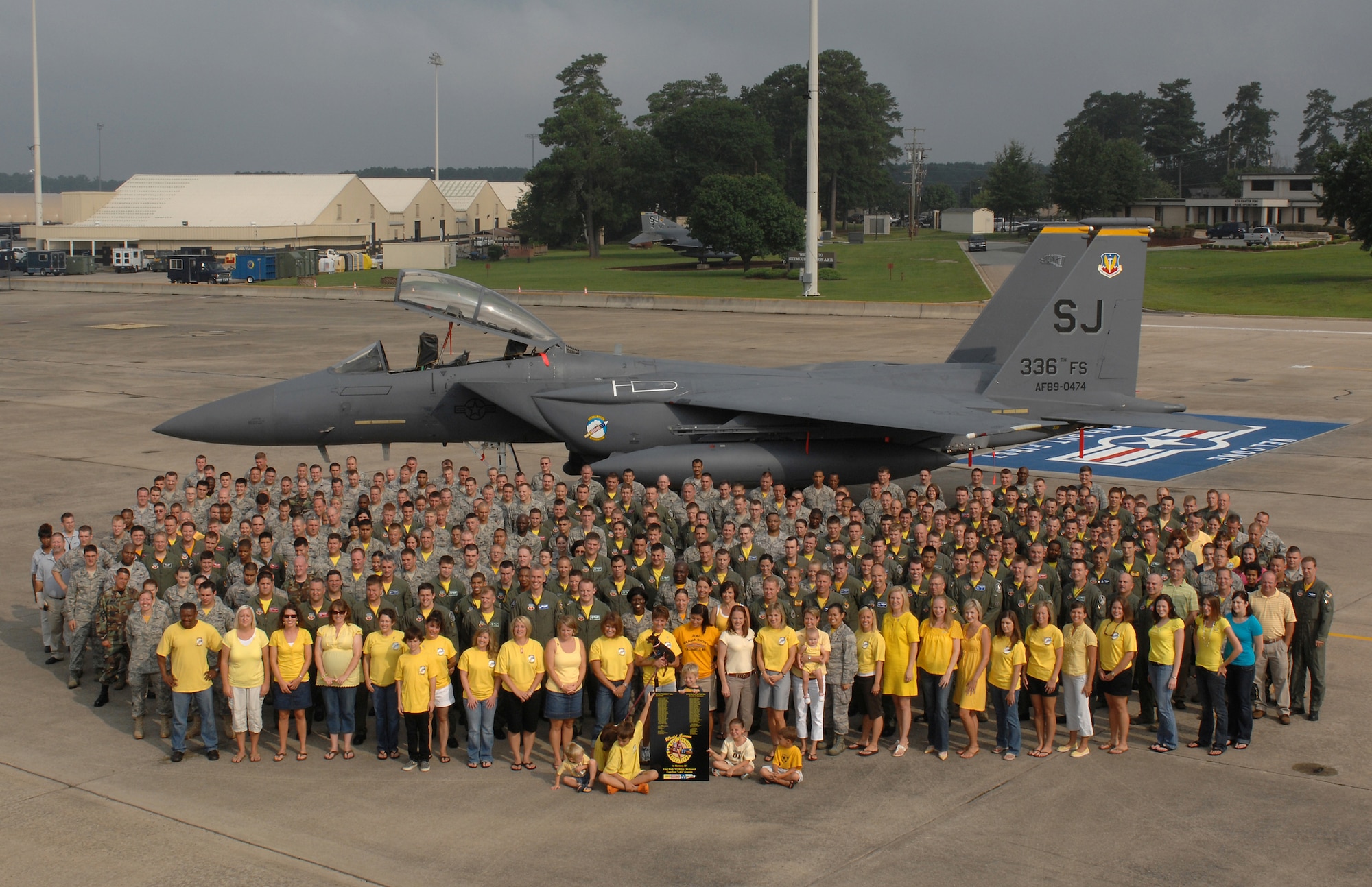 Friends, family, and fellow aviators show their support for the 336th Fighter Squadron ?Rocketeers? by gathering around the new squadron flagship on the flightline at Seymour Johnson Air Force Base, N.C., July 24, 2009.  The F-15E fighter will be sent to Afghanistan to replace the aircraft lost when Captains Mark R. McDowell and Thomas J. Gramith were killed July 17, 2009.  They mark the first aircrew deaths since Maj William R. Watkins III and Capt Eric B. Das were lost during Operation Iraqi Freedom on April 7, 2003.