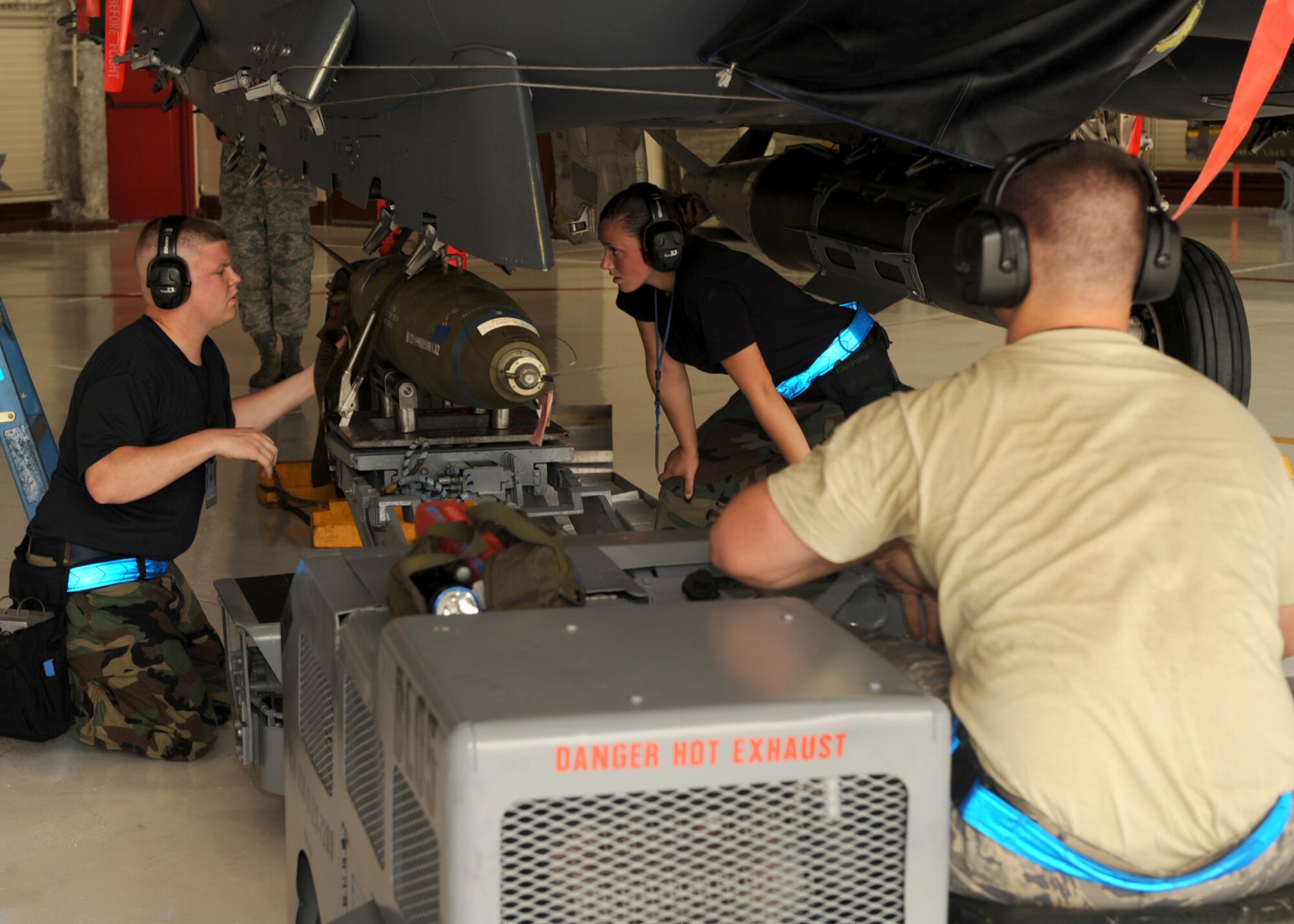 334th Aircraft Maintenance Unit Weapons loaders attach a Mark 82 bomb to an F-15E Strike Eagle during a load crew competition on Seymour Johnson Air Force Base, N.C., July 17, 2009. The weapons loaders were timed on speed, accuracy and capability to correctly load a 500 lb MK-82 bomb and others onto a jet. The weighs (U.S. Air Force photo by Senior Airman Ciara Wymbs)  