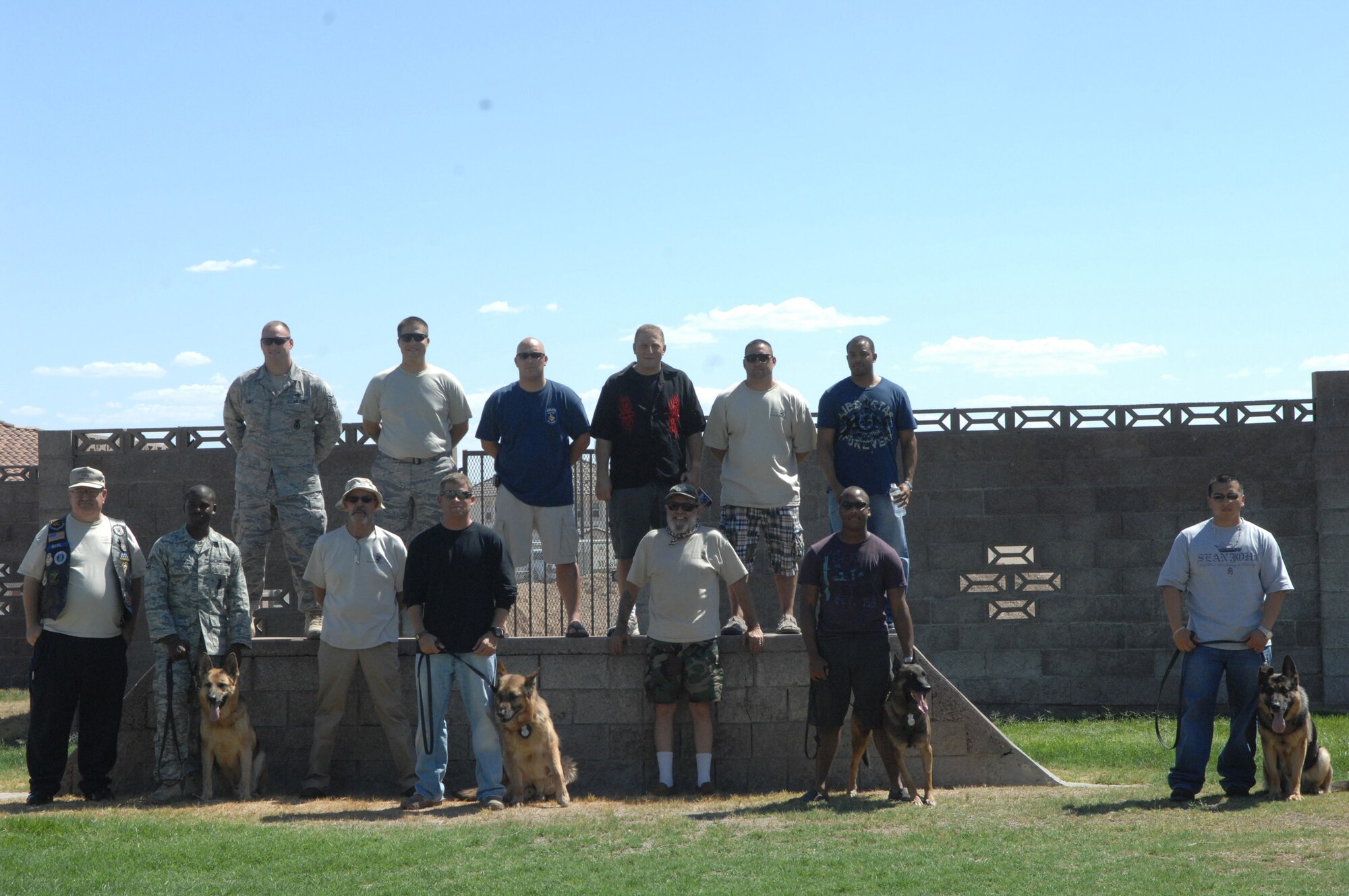 The 99th Security Forces military working dog handlers and their families were visited by Feed the Dawgs, an organization of Vietnam veteran dog handlers who visit various bases to thank military canine handlers, June 27. The veterans treated the Nellis and Creech Airmen to a steak meal and exchanged stories. Feed the Dawgs has reached more than 200 active duty military working dog handlers and their families, since its inception in 2007.(courtesy photo)
